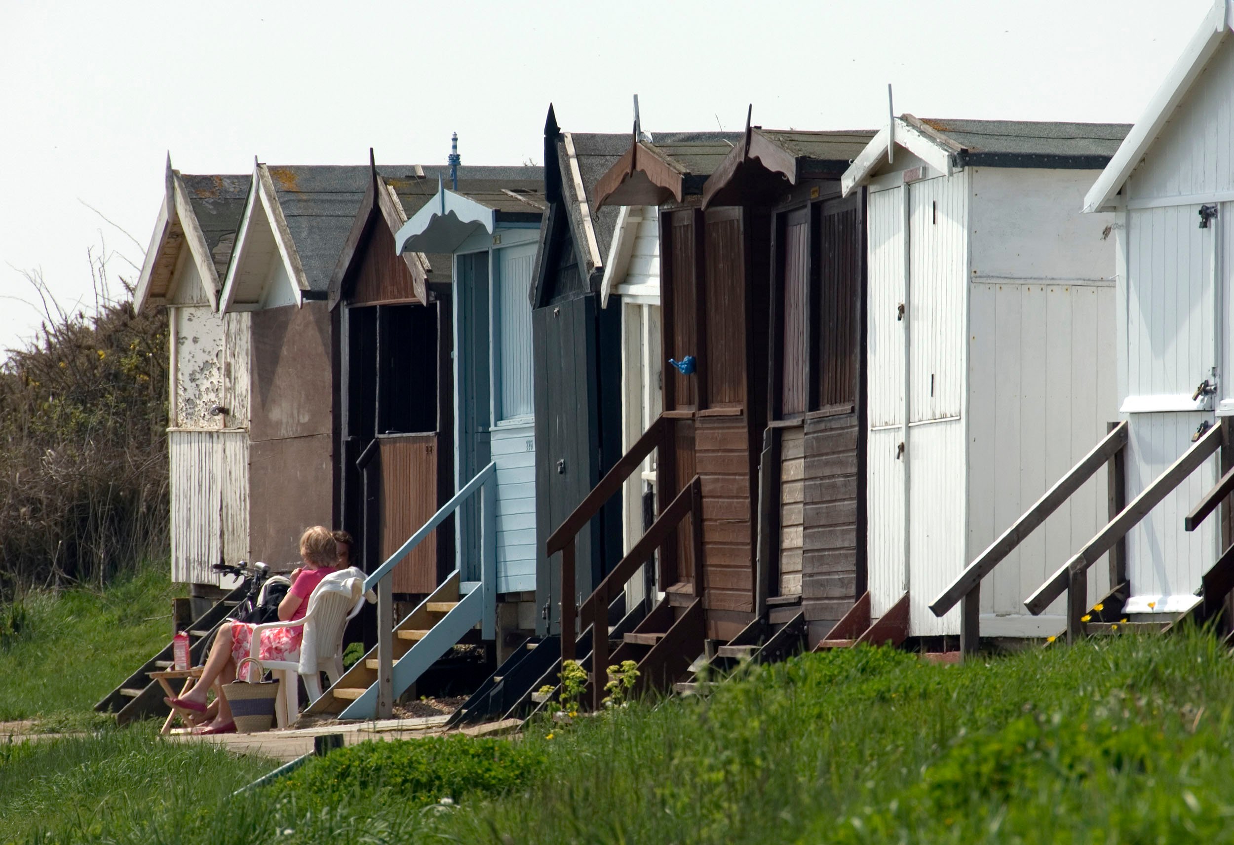 Image of colourful beach huts in Frinton-on-Sea.