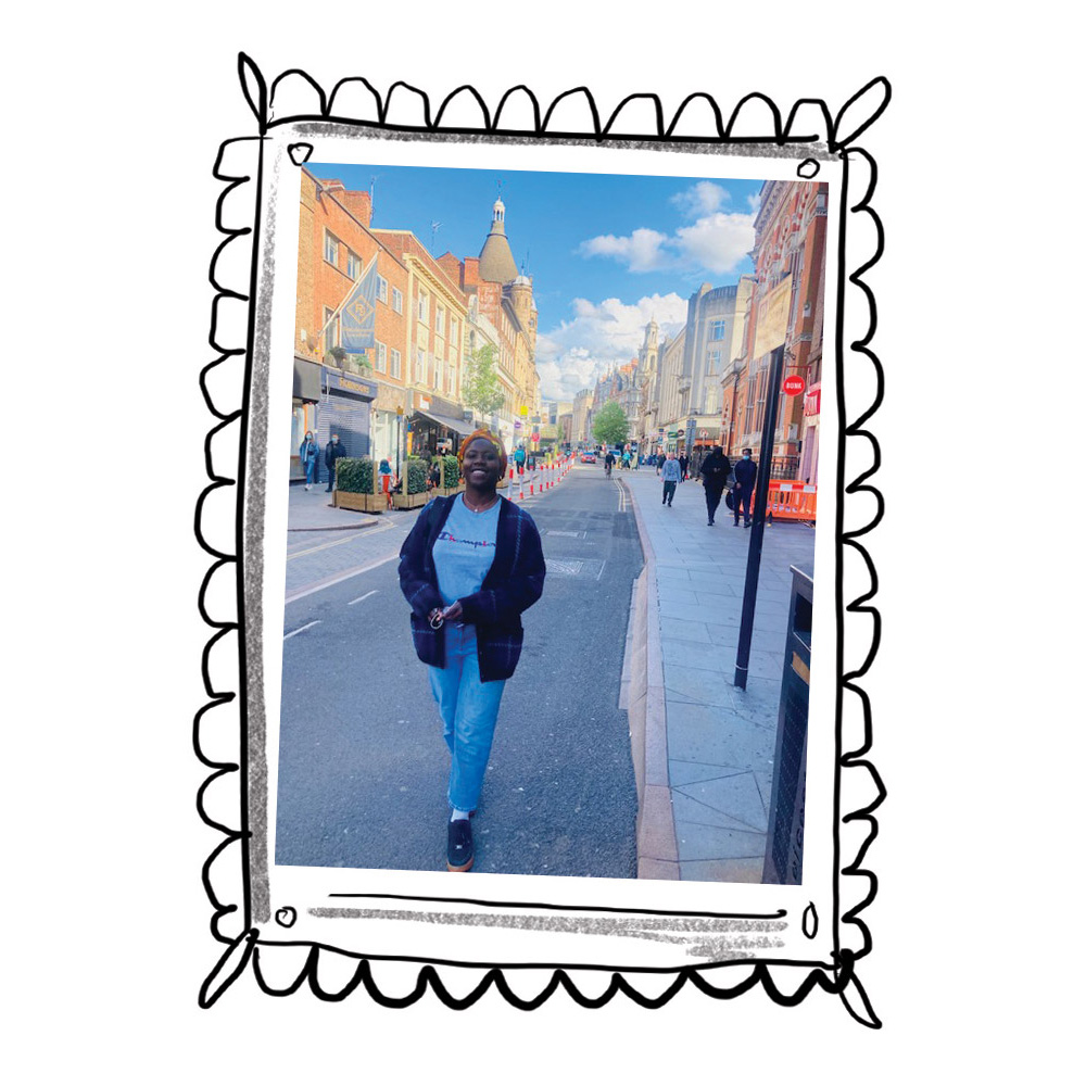Photo of woman in her twenty's walking down Granby Street in Leicester looking happy. Photo is displayed inside a hand-drawn frame.