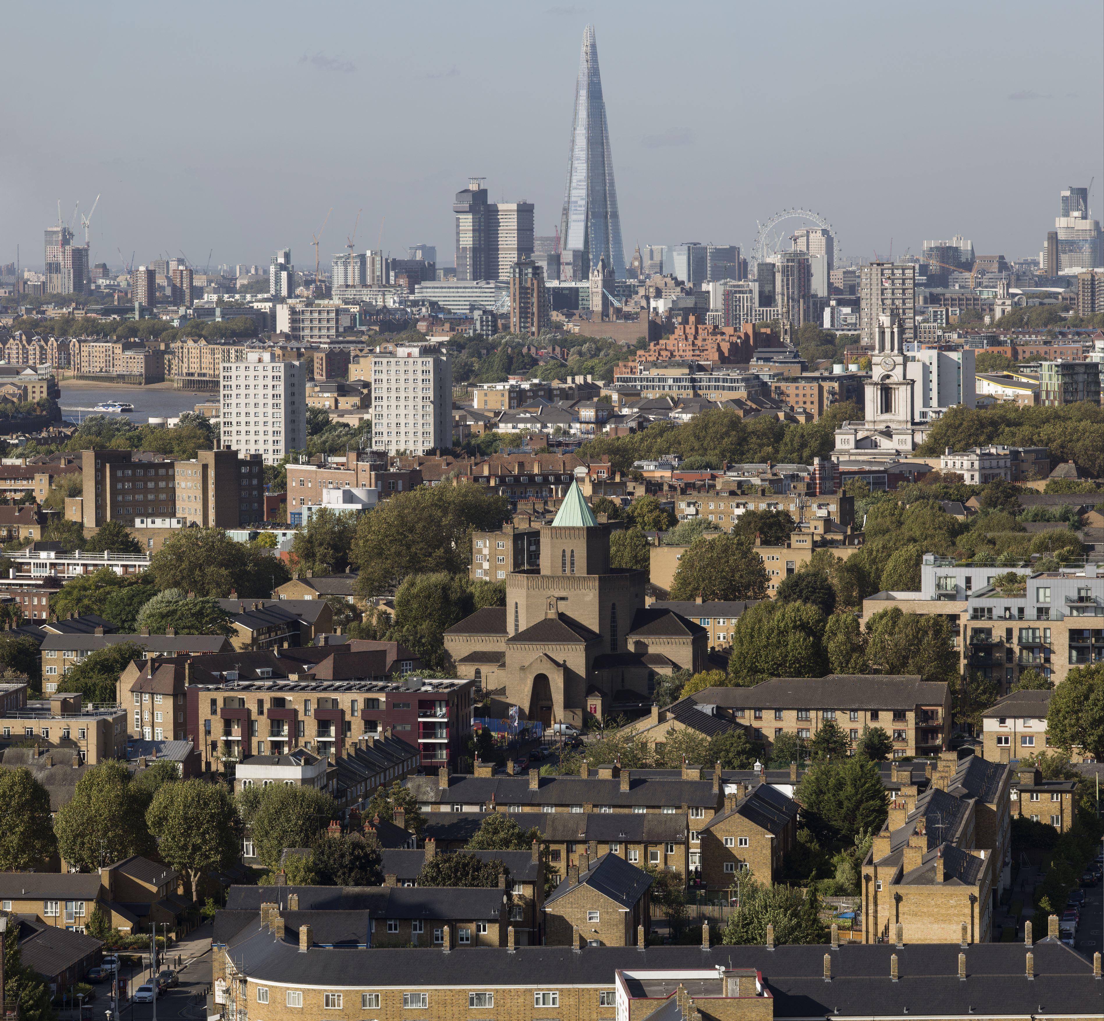 View across London rooftops to the central London skyline beyond.