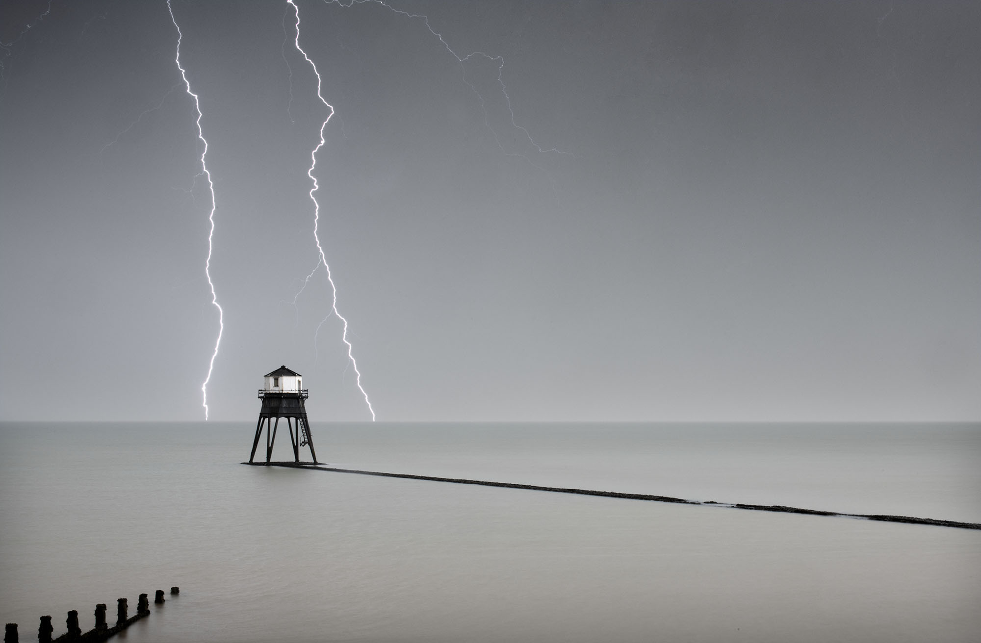 General view of the Dovercourt outer lighthouse with stormy sky and lightening