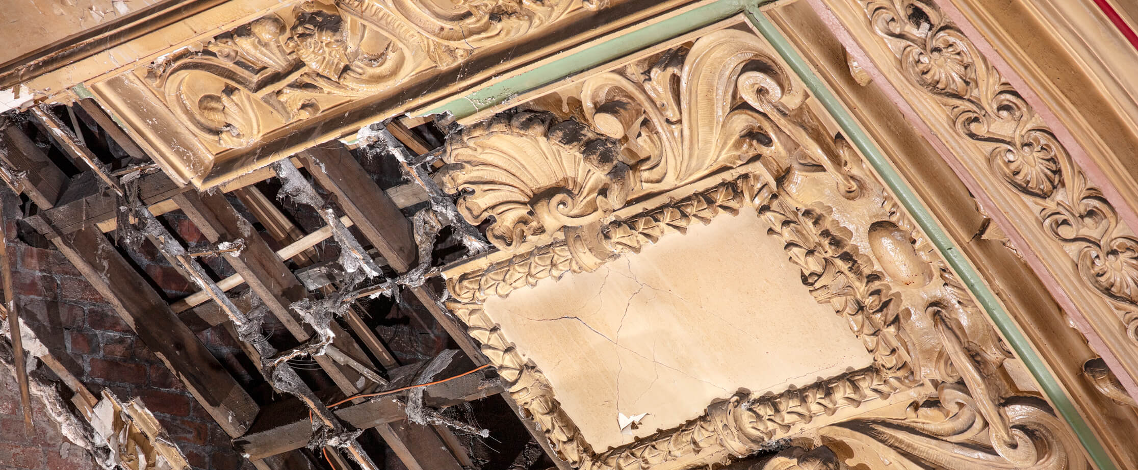 Detail of damaged plasterwork ceiling moulding.