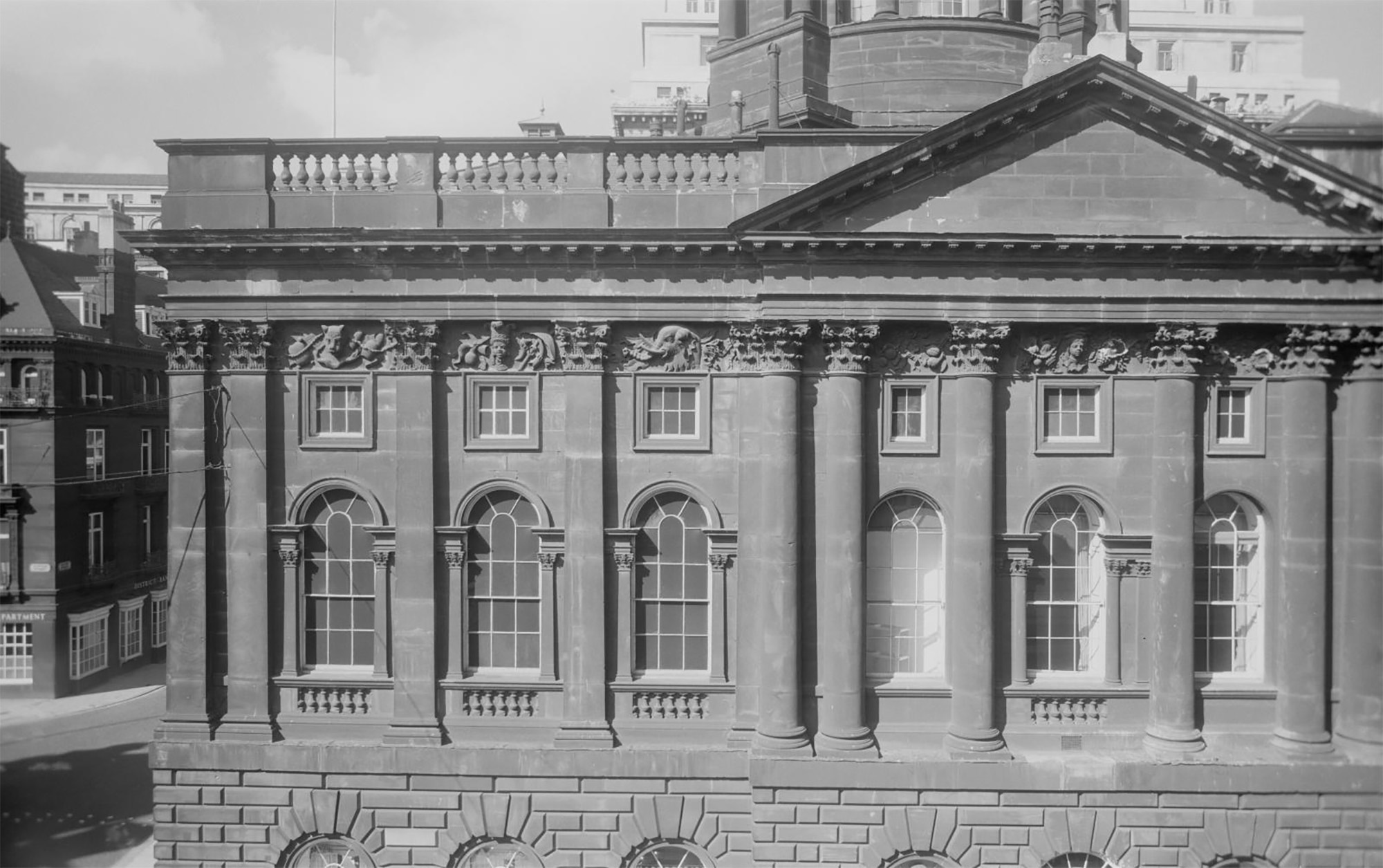 A black and white archive photograph of the exterior facade of Liverpool Town Hall.