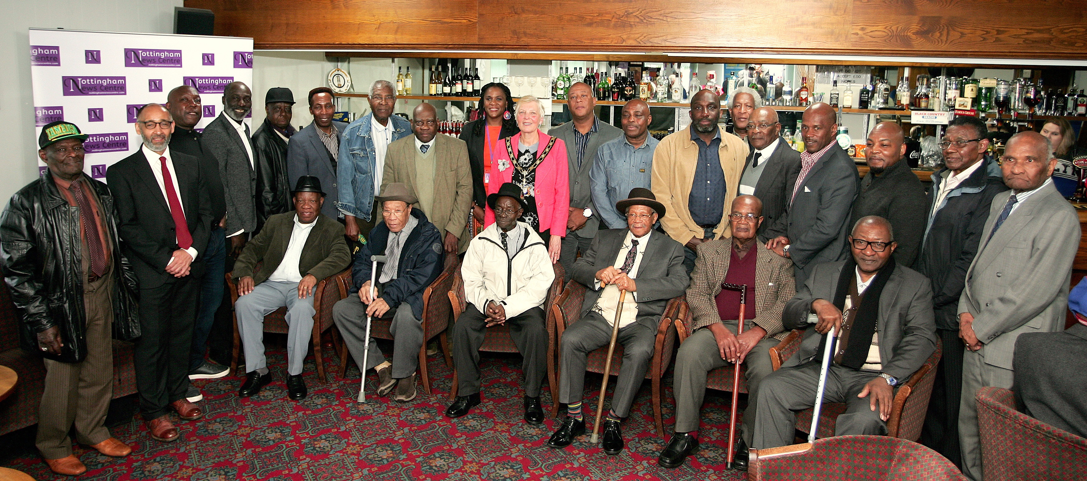 Former miners pose for a group photo at a reunion organised by the Black Miners Museum.