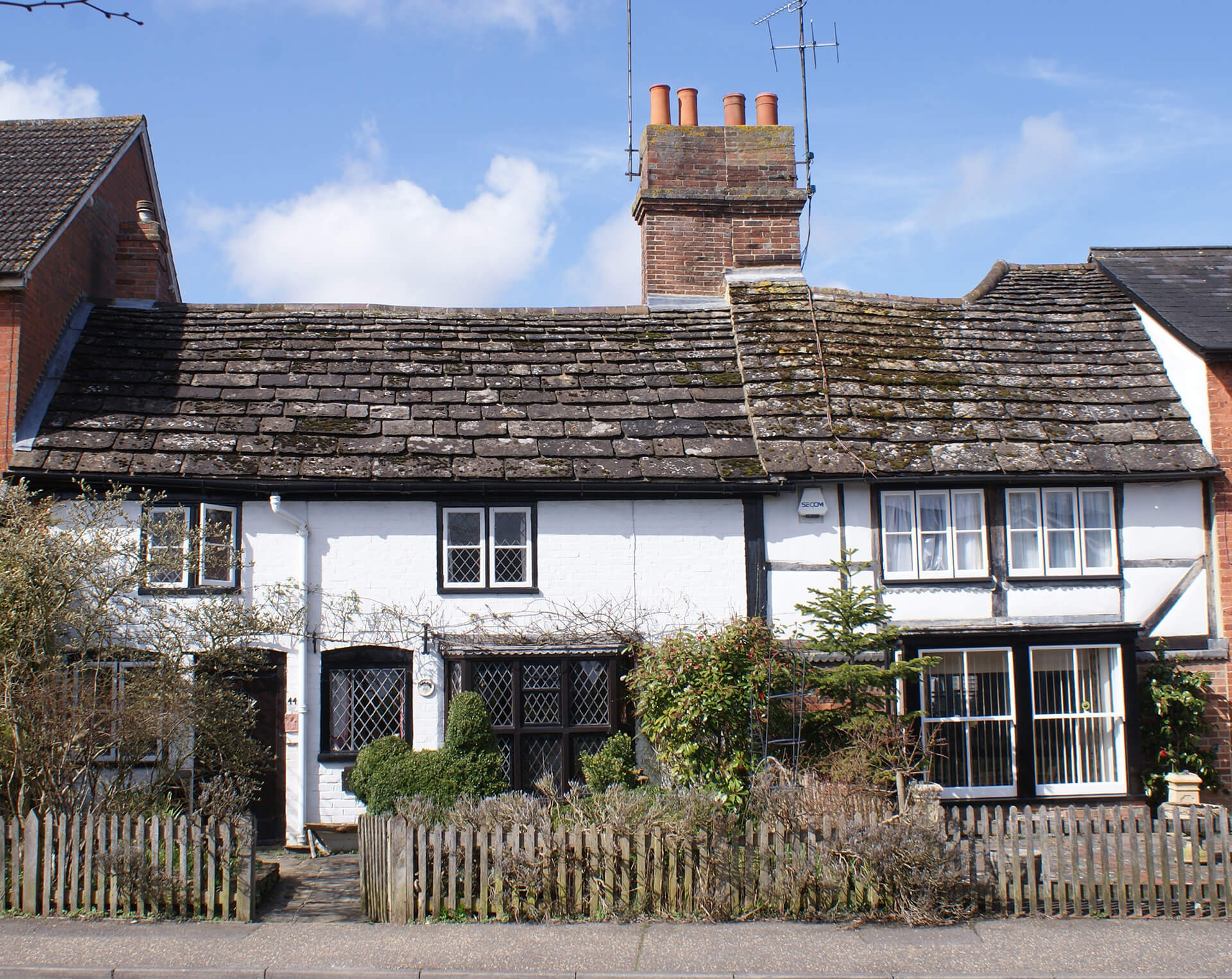 a row of cottages with horsham slate roofing