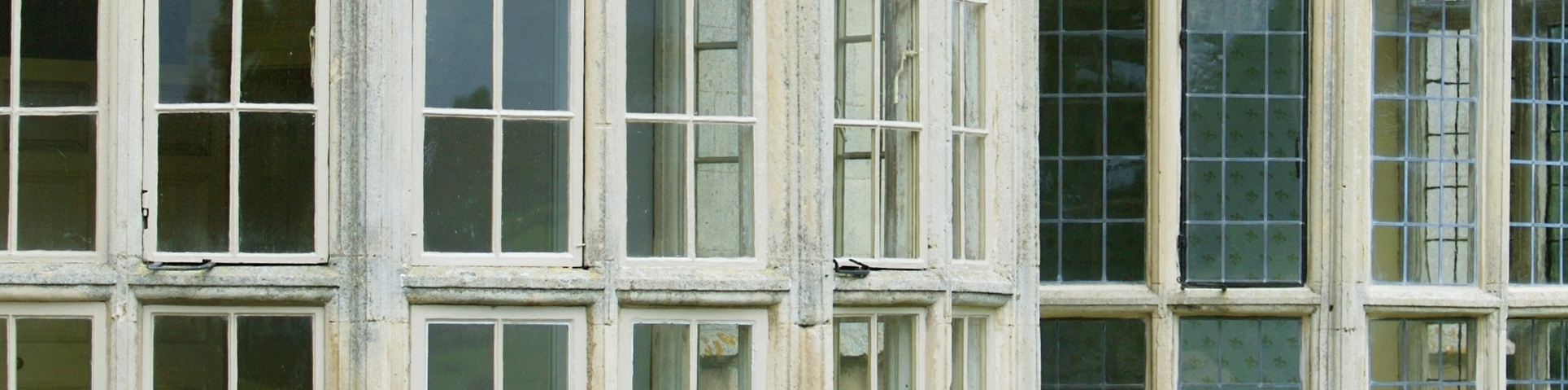 Window frames in a historic building decorated using lead paint.