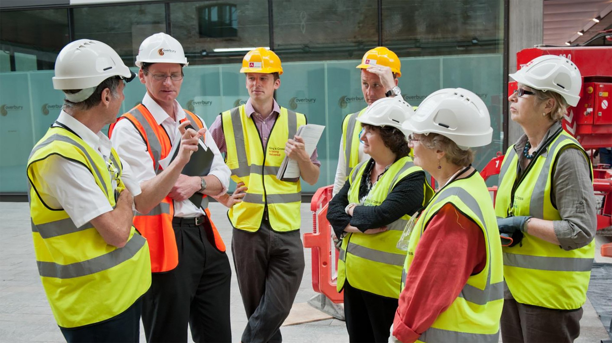 A group of experts meeting a project manager on-site