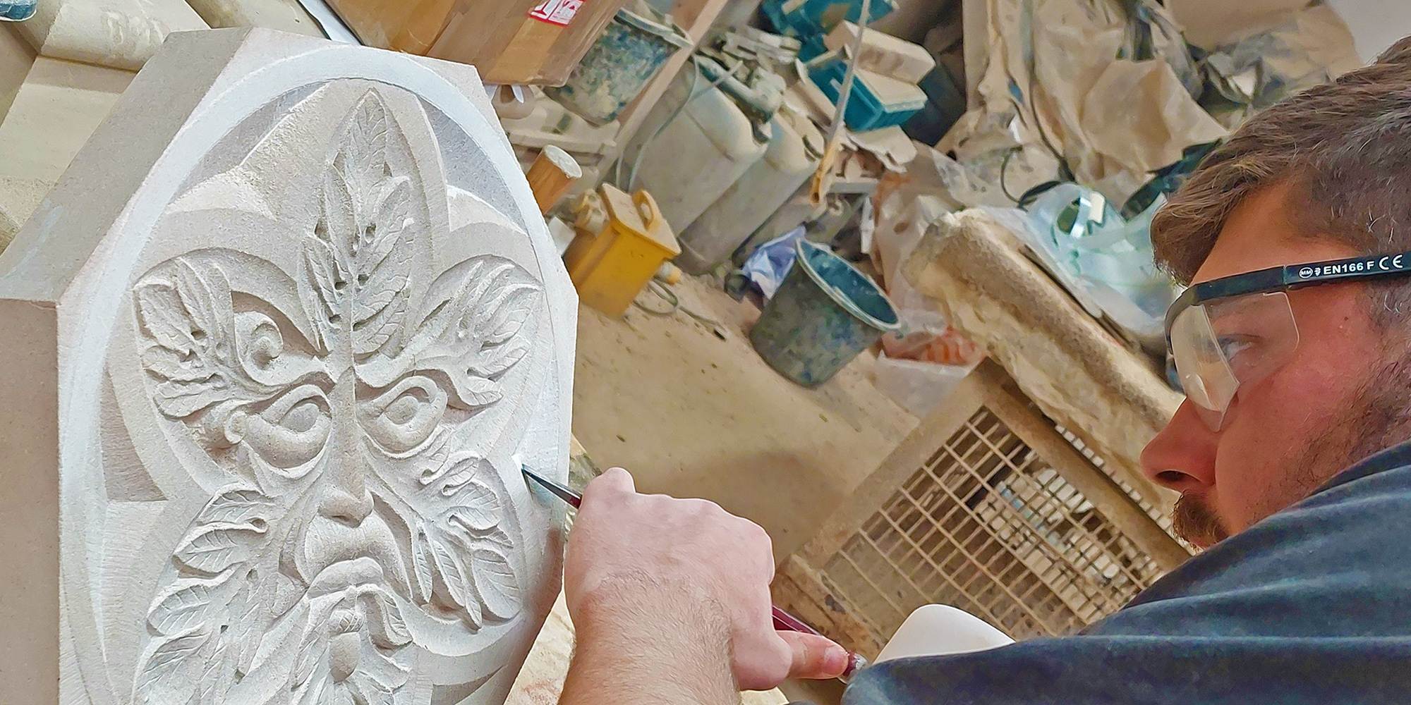 Stonemasonry apprentice Matthew Tinsley works on an ornamental piece.