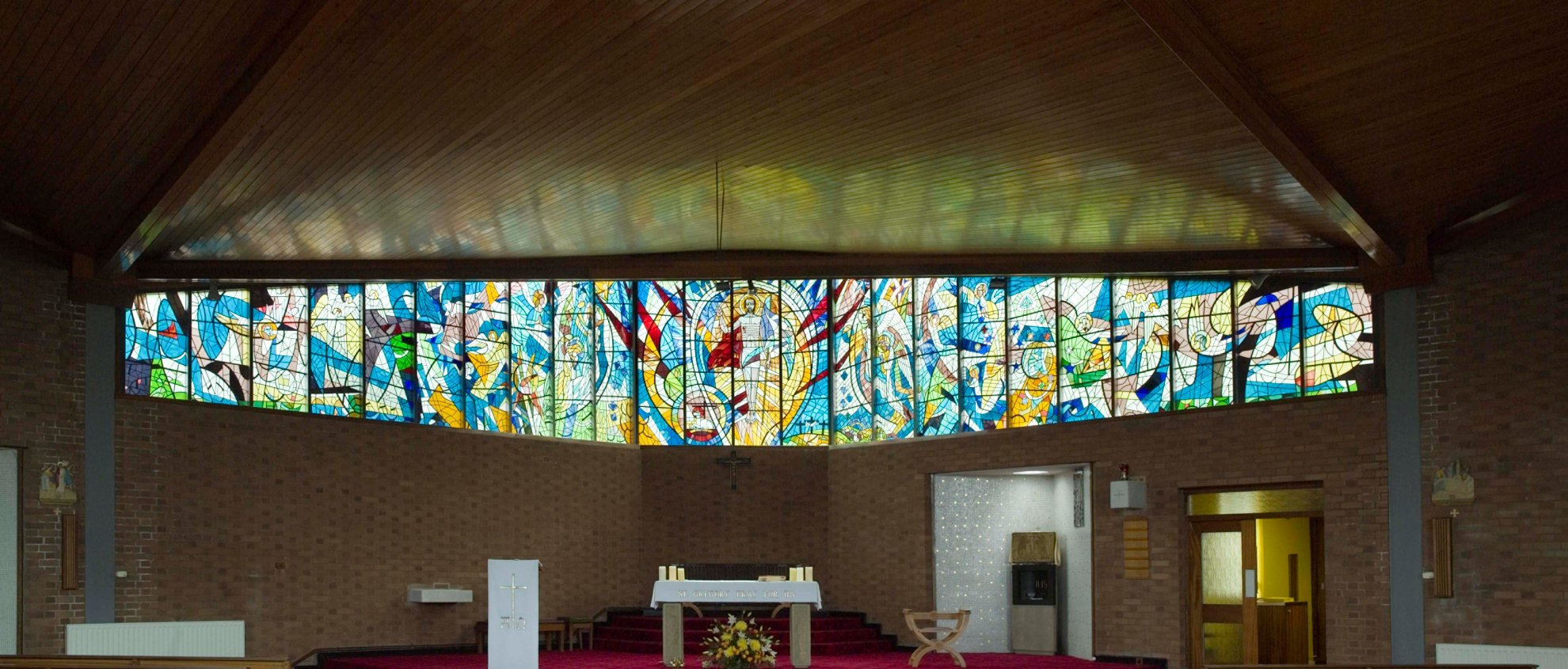 East stained-glass window and sanctuary of St Gregory the Great Roman Catholic church, Swarcliffe, Leeds
