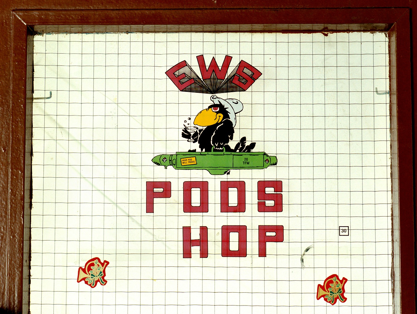 RAF Upper Heyford, Oxfordshire, cartoon on the workshop door of the Electronic Warfare Squadron, the cartoon raven references the nickname of the F111 aircraft.