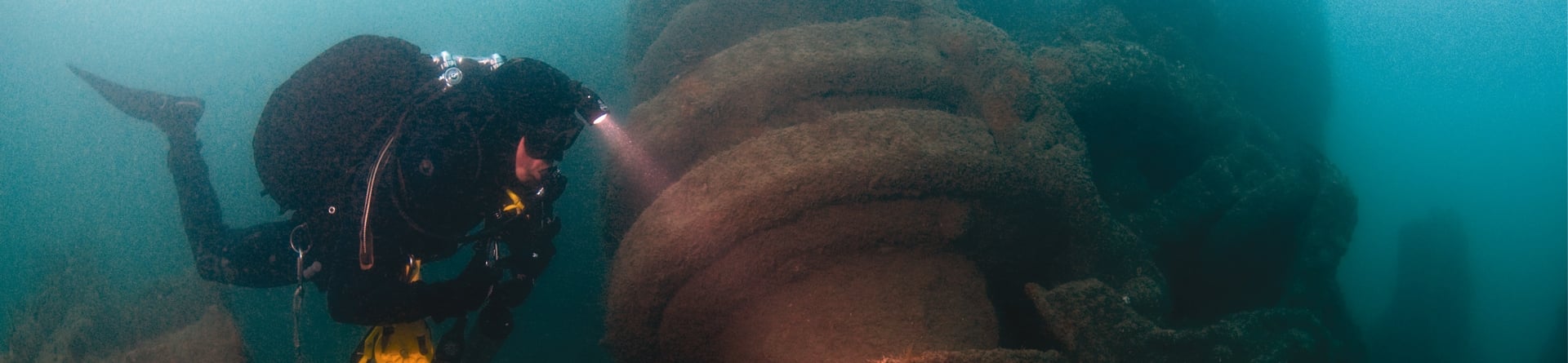 A diver examines the anchor winch of the War Knight on the sea bed.