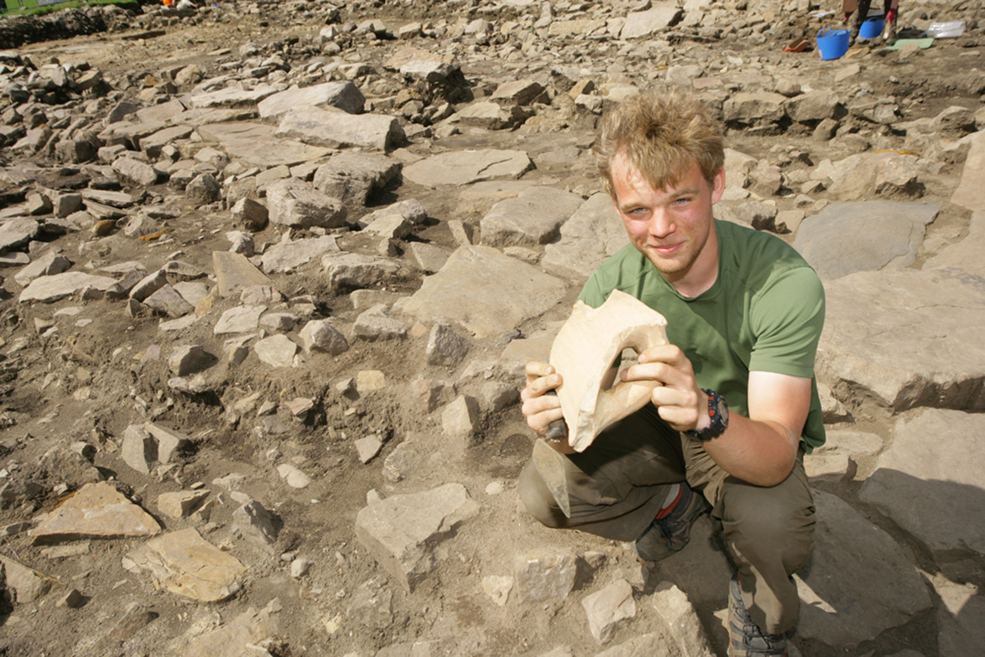 Young man holding an artefact
