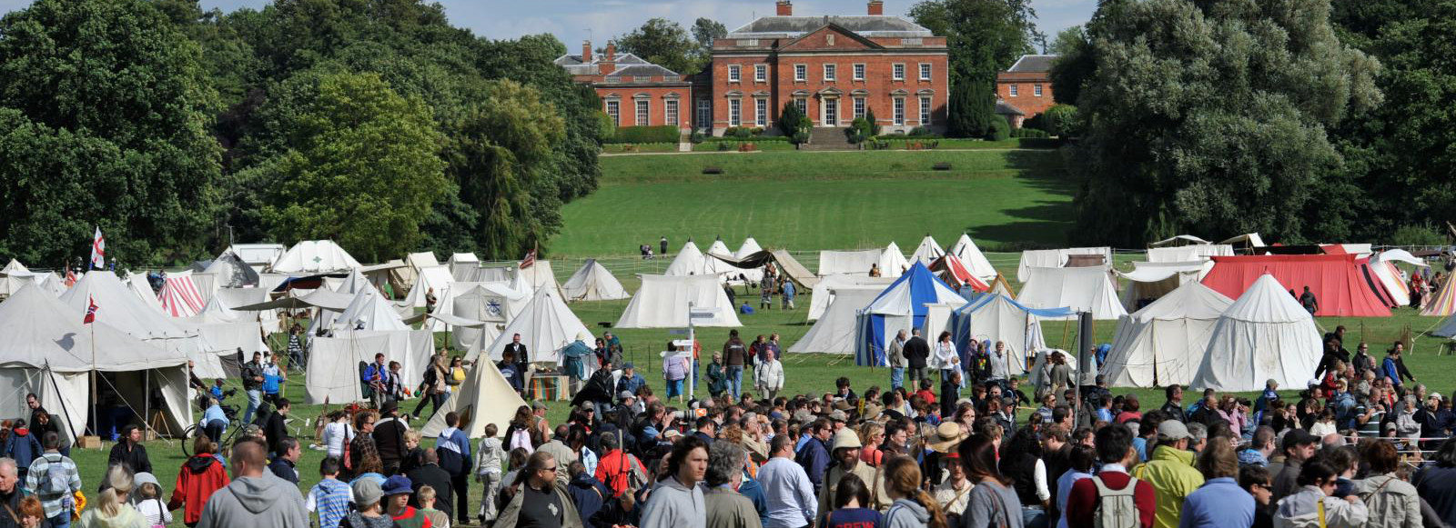 Crowd attending Festival of History with Kelmarsh Hall in the background