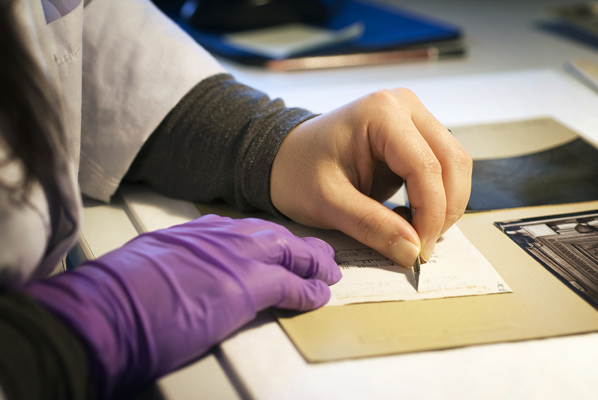 England's Places: A conservator cleaning a card