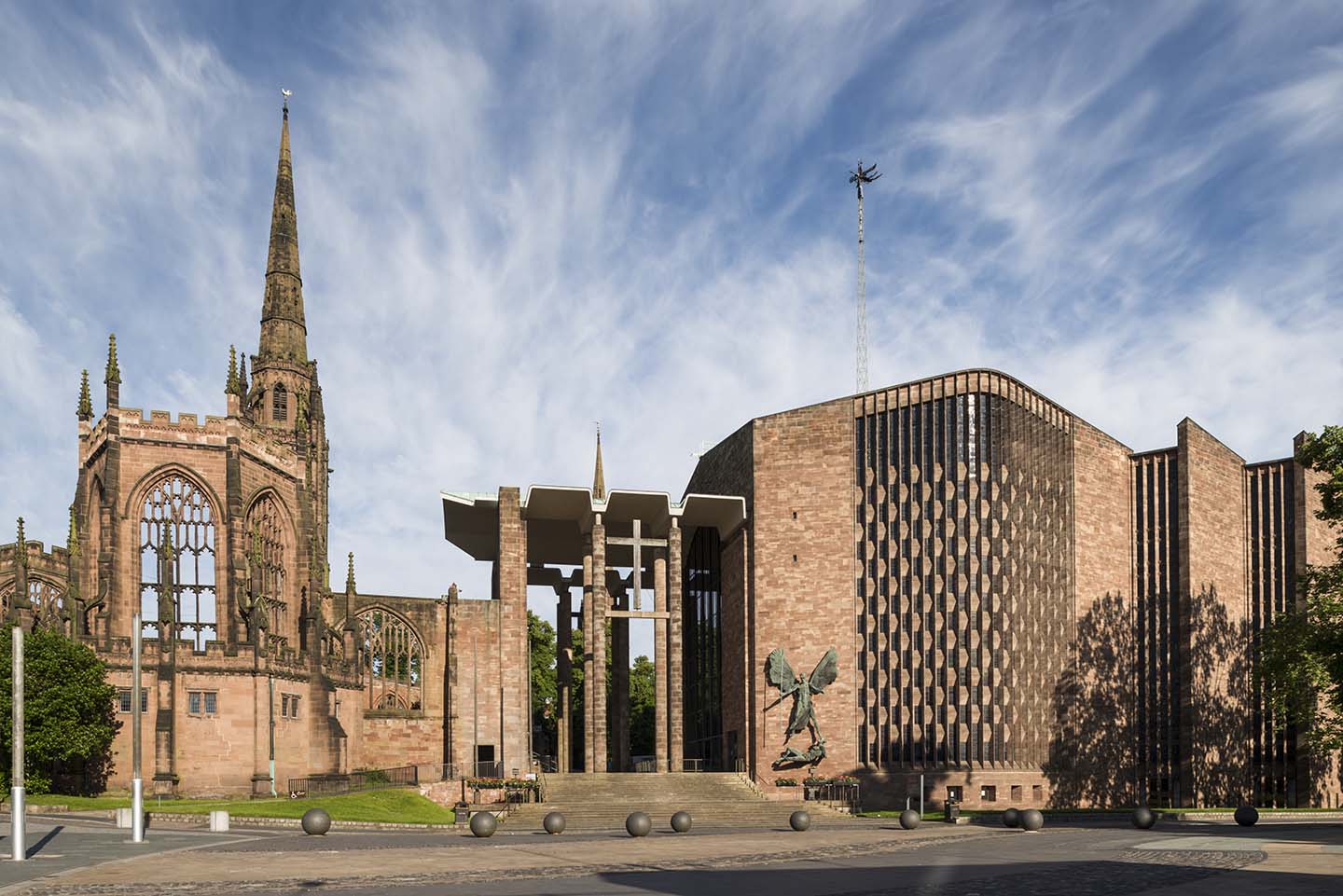 Coventry Cathedral, east elevation to Priory Street with the new porch and Lady Chapel of the old cathedral.  Jacob Epstein's bronze of St. Michael and the Devil on the wall of the babtistery