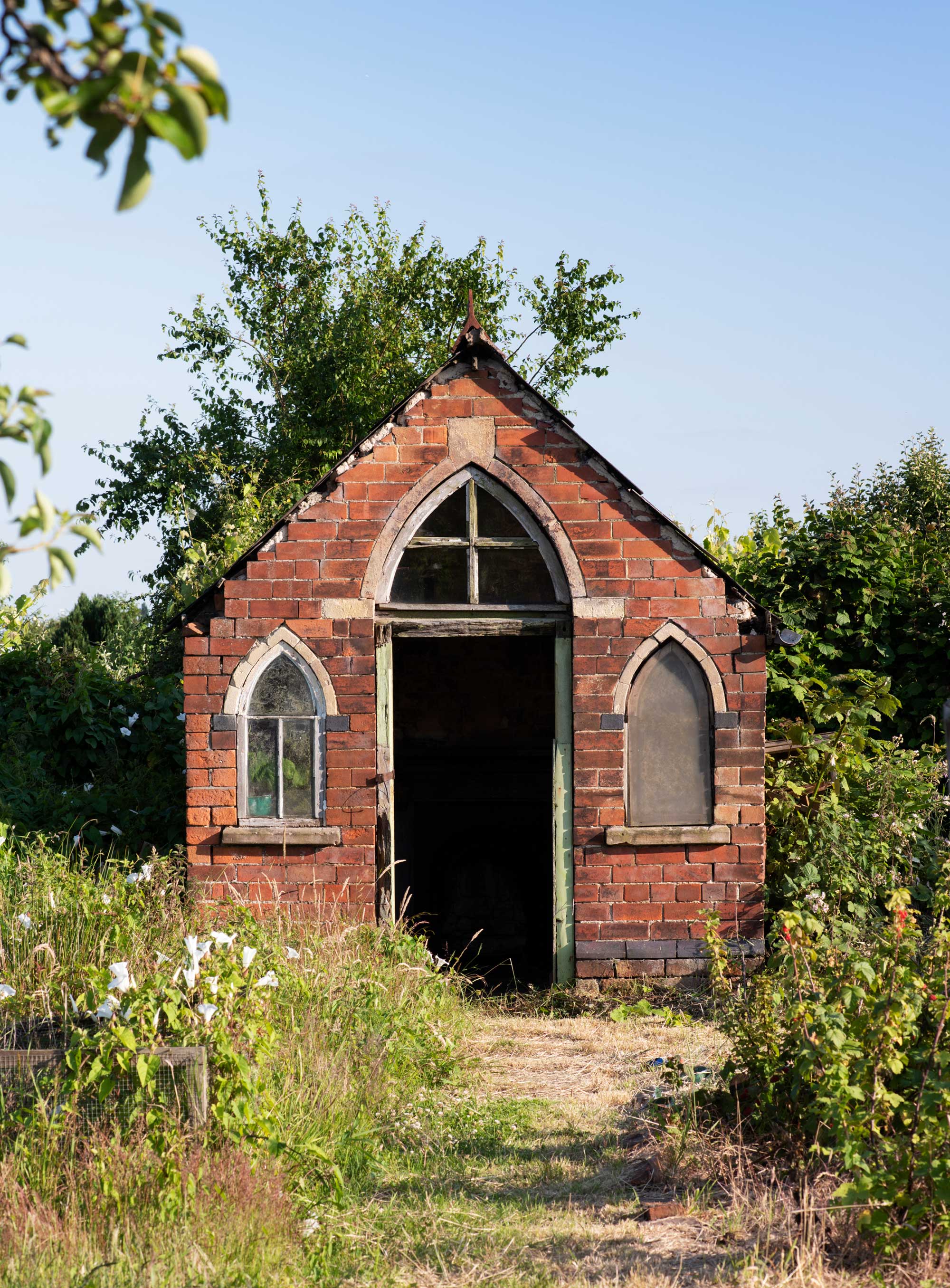 A small brick building on an allotment.