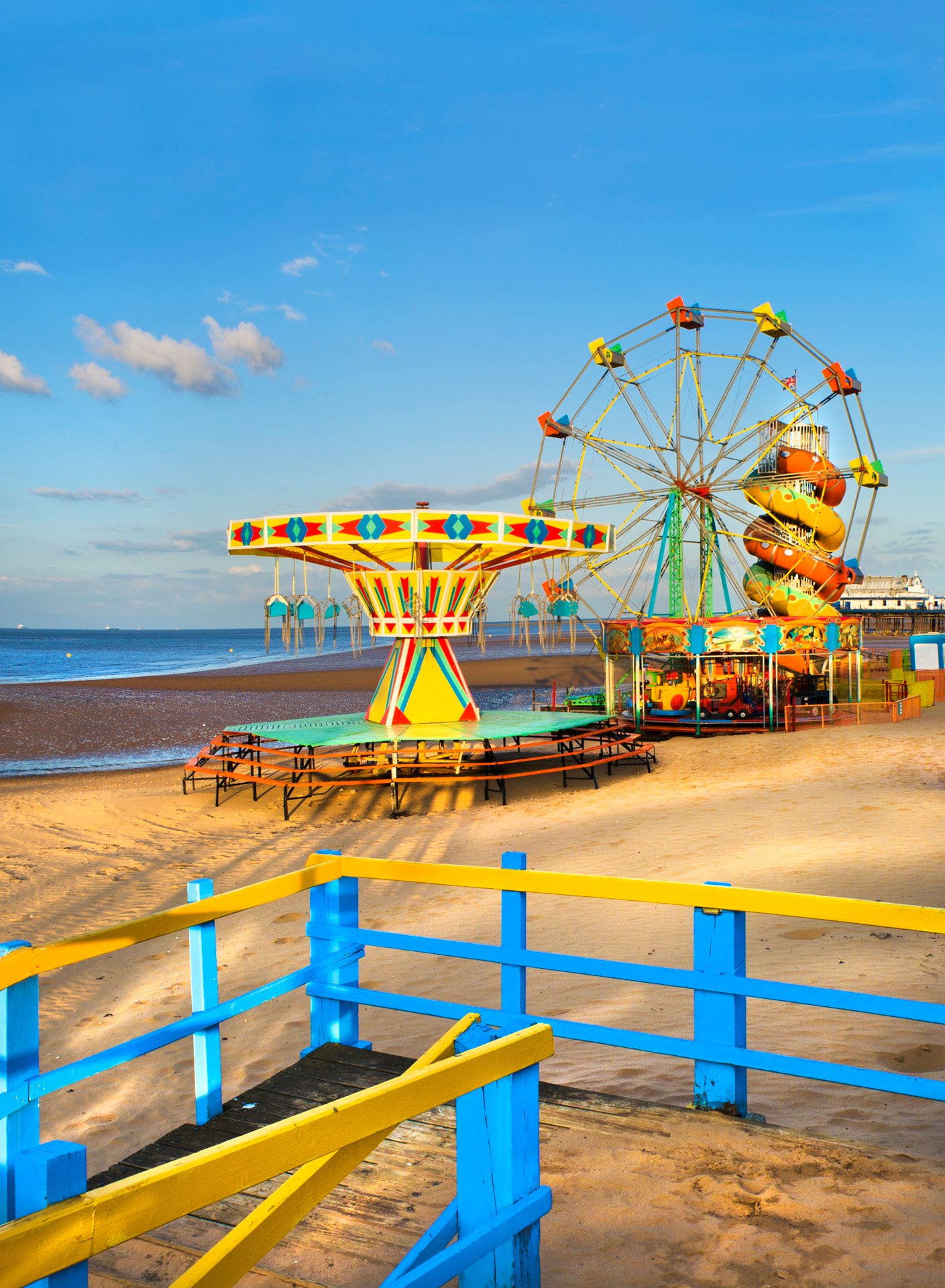 Colourful amusement rides on the beach at Mablethorpe, Lincolnshire.
