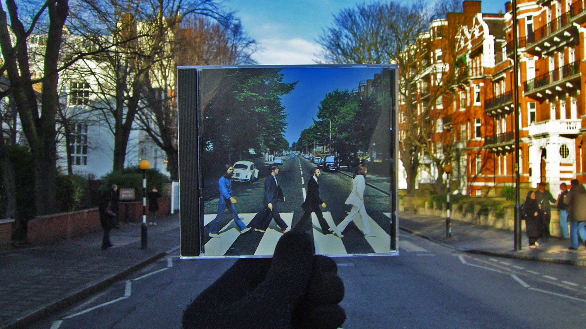 The famous zebra crossing near Abbey Road Studios and the Beatles Album cover "Abbey Road" which immortalised the street.
