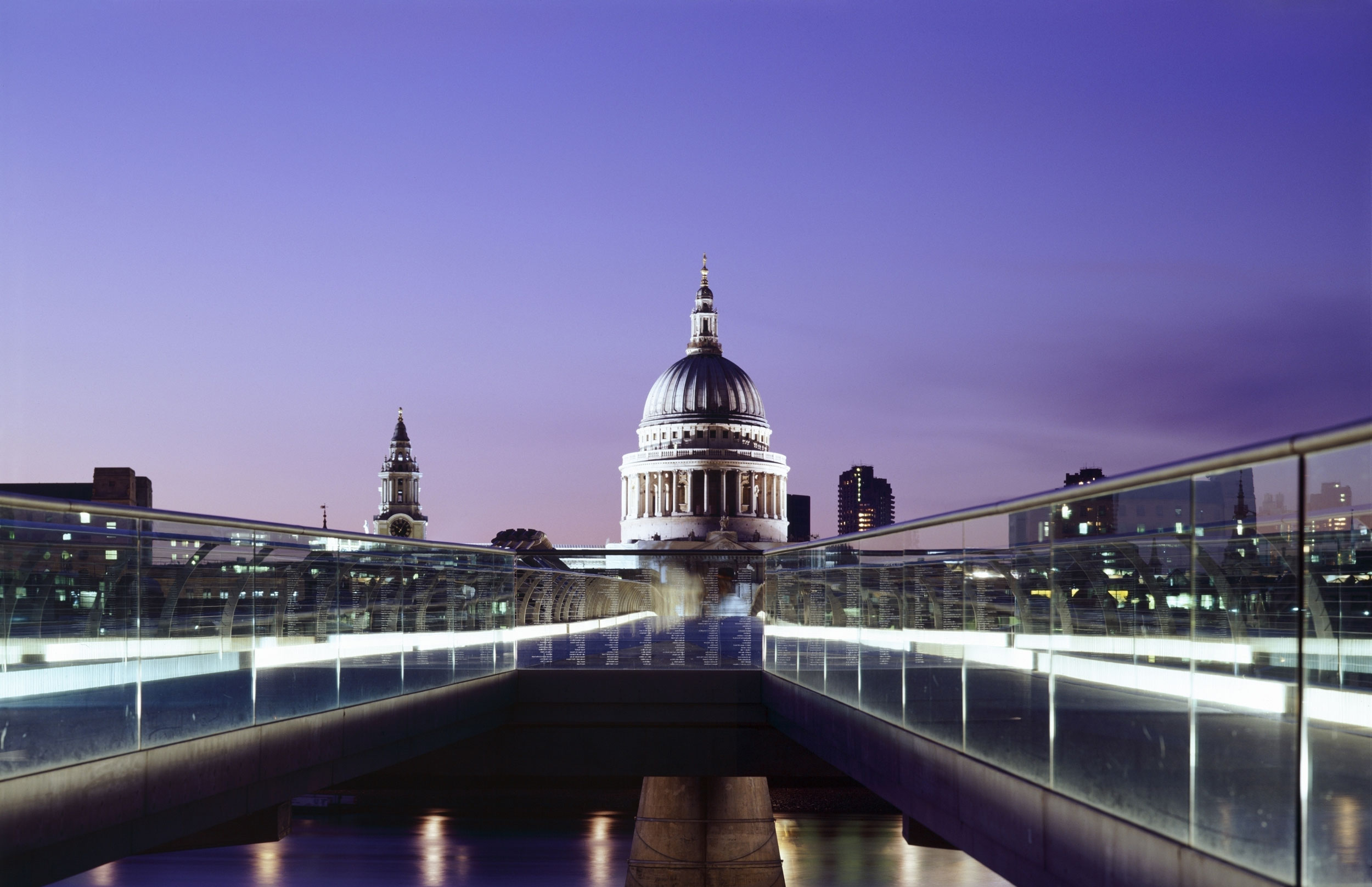 St Paul's cathedral at night, viewed across the London Millenium Footbridge.