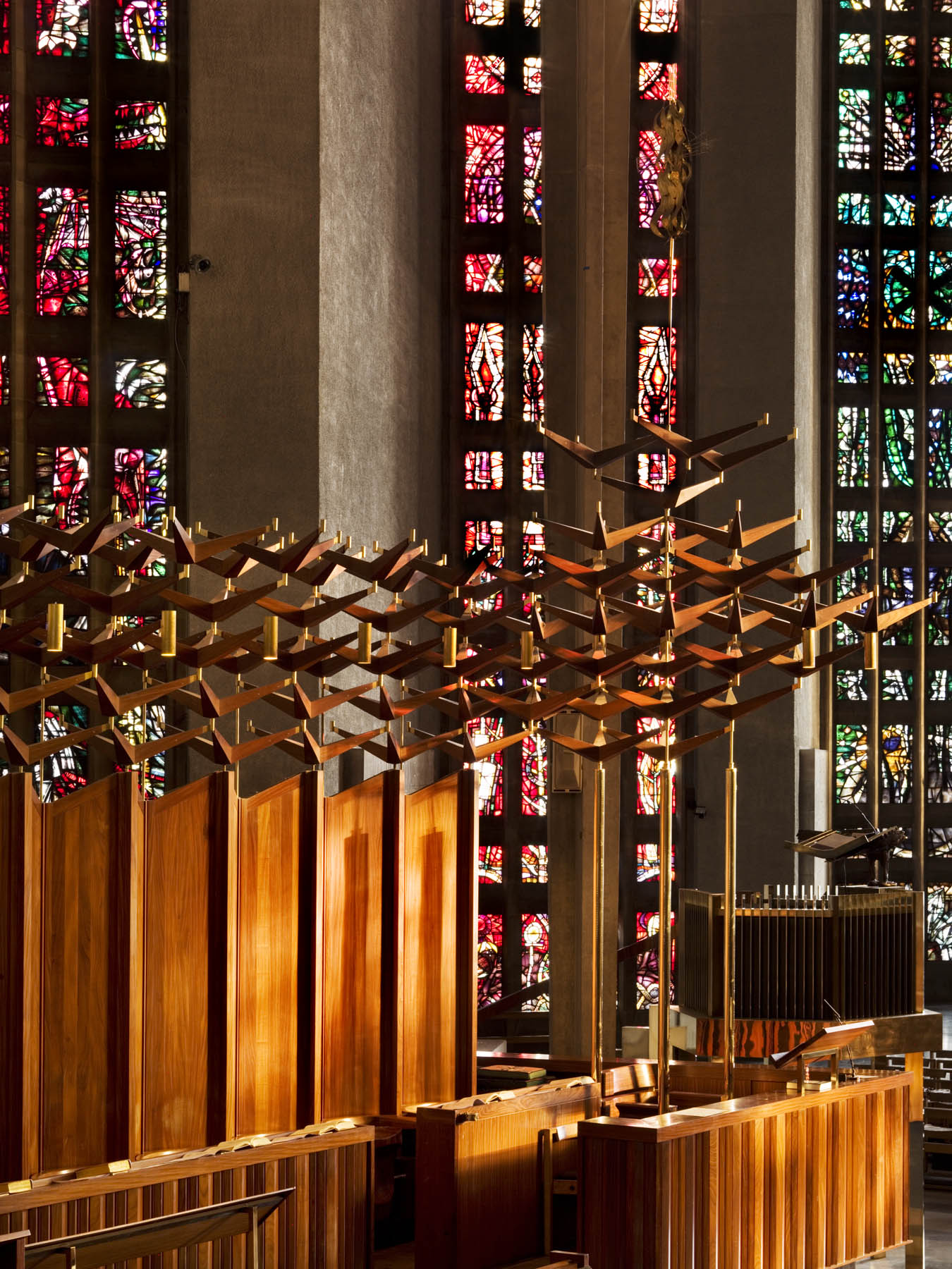 Detail of choir stalls and stained glass in Coventry Cathedral Church of St Michael