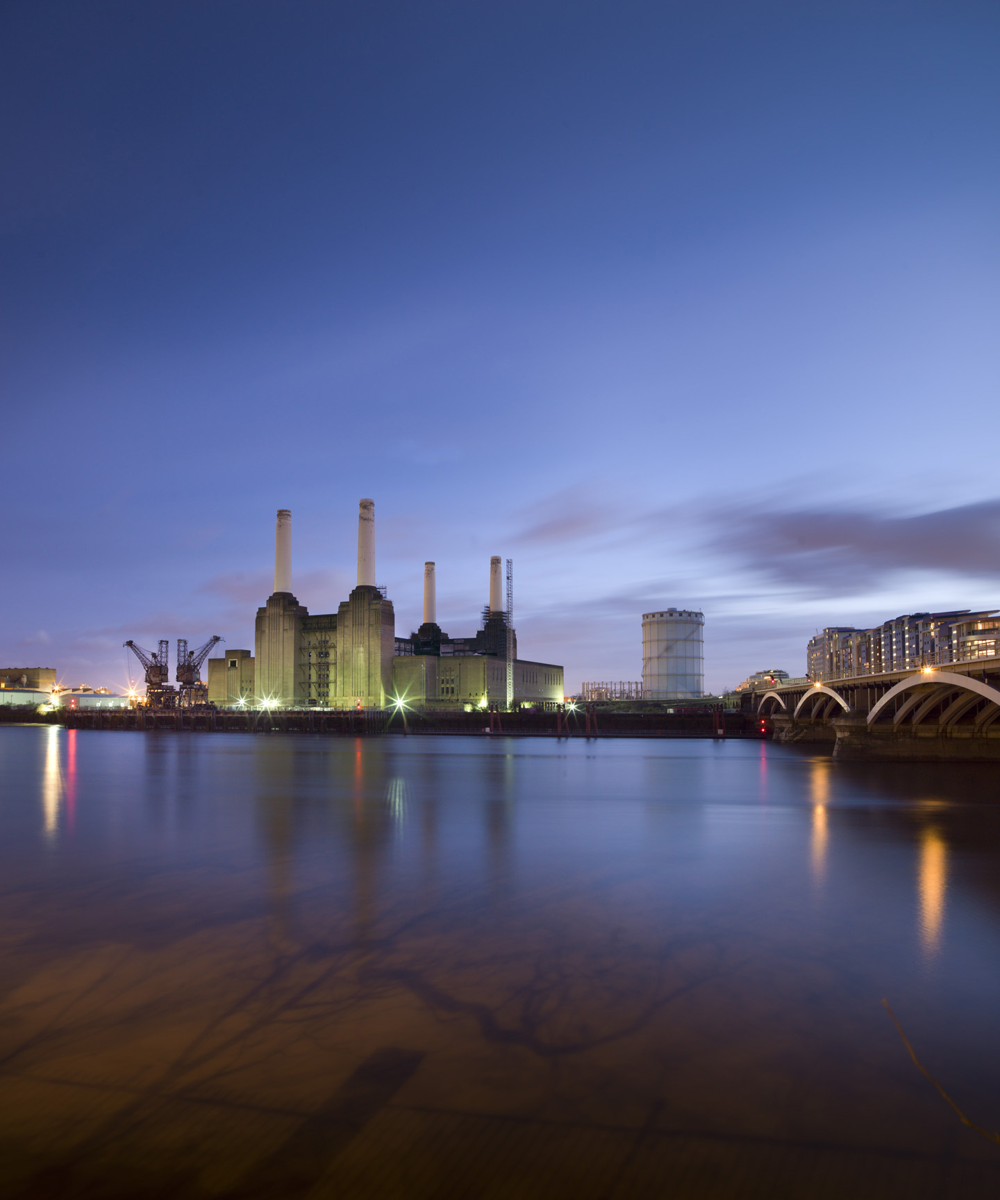 View of Battersea Power Station across the Thames at sunset.