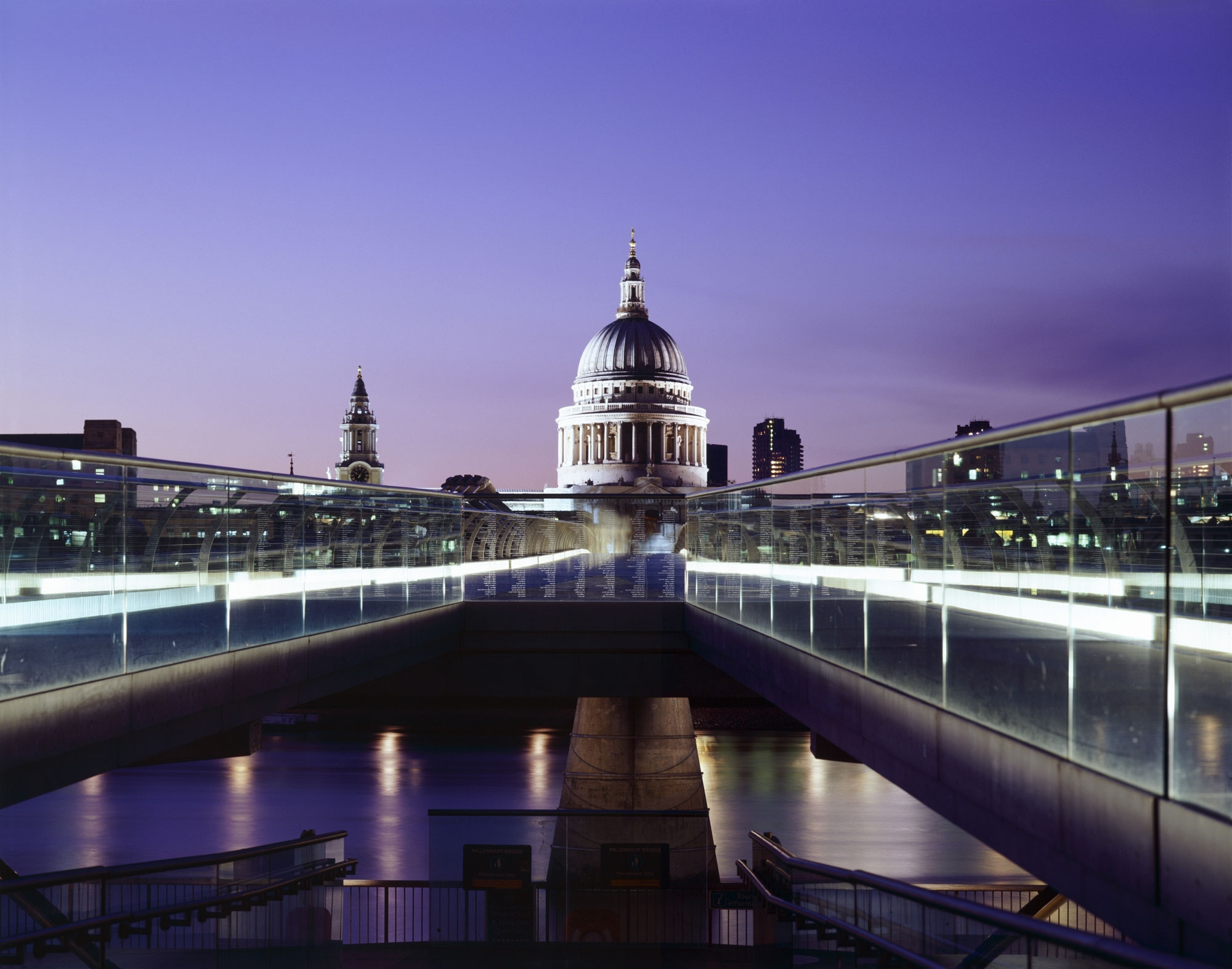 St Paul's Cathedral and the London skyline viewed across the Millennium Bridge.