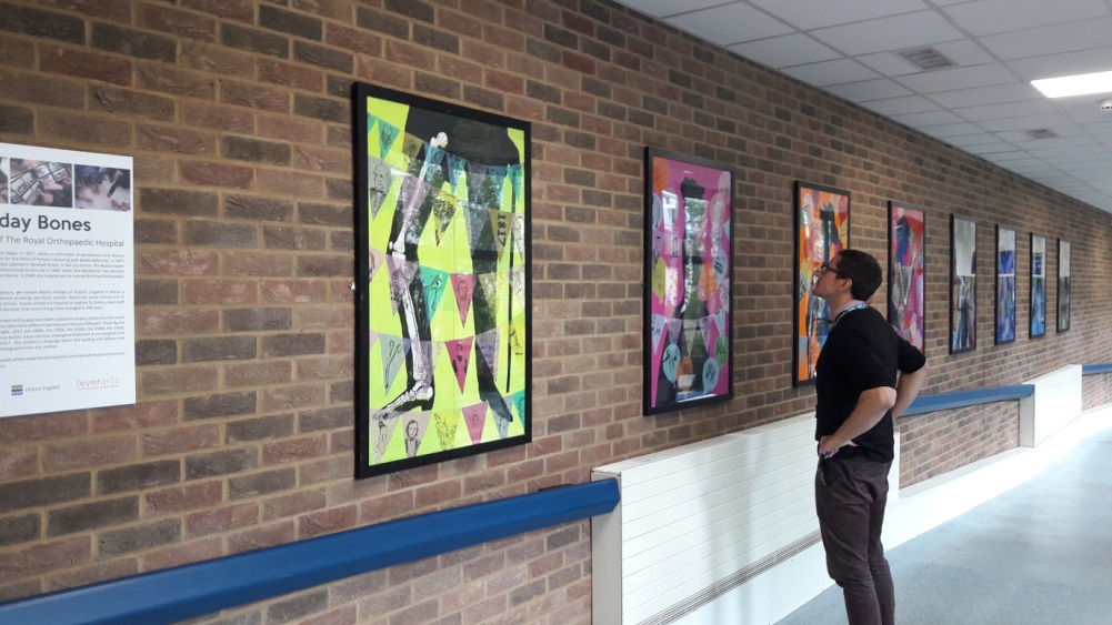 A member of core ROH staff viewing an exhibition of prints at Birmingham's Royal Orthopaedic Hospital.