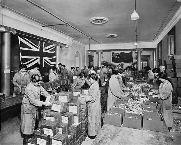 Australian Red Cross premises, 18 Regent Street, London, January 1917.  Women packing food parcels for prisoners-of-war. (BL23706-001)