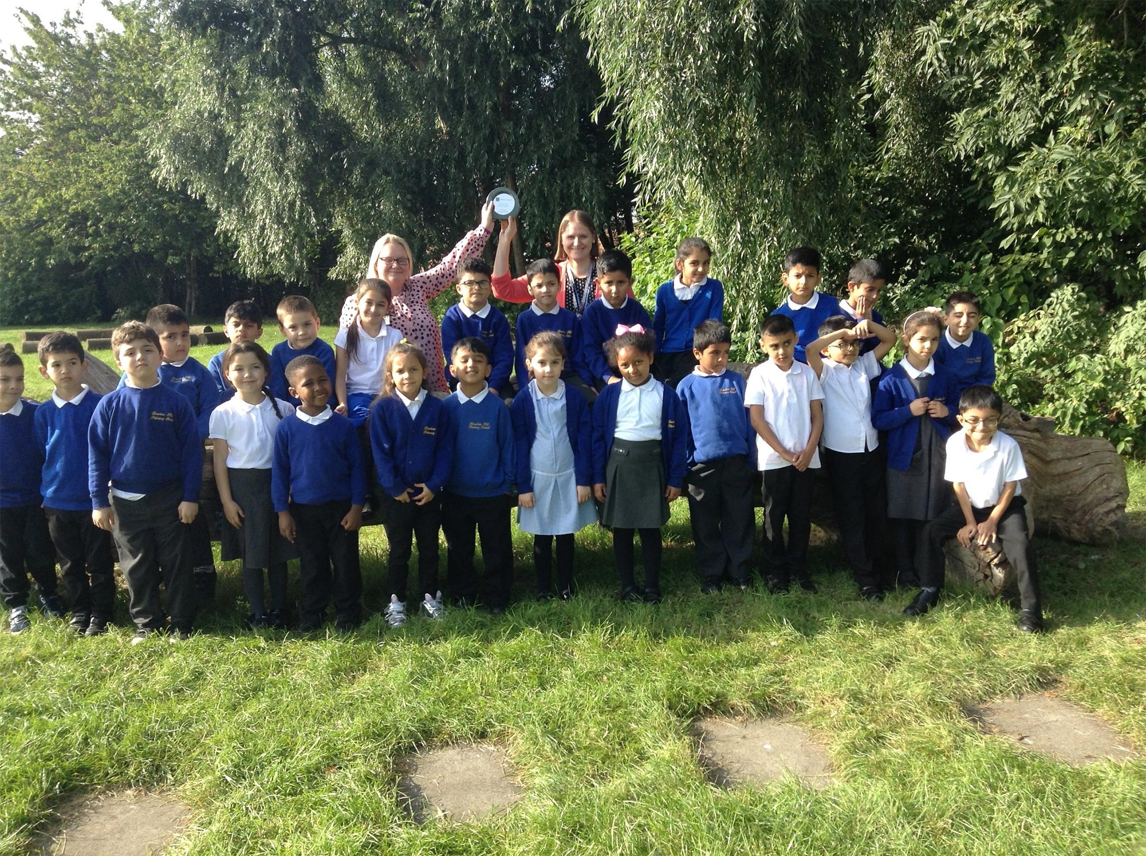 Teachers and pupils from Breckon Hill Primary School in Middlesbrough with their Champion Heritage School Award