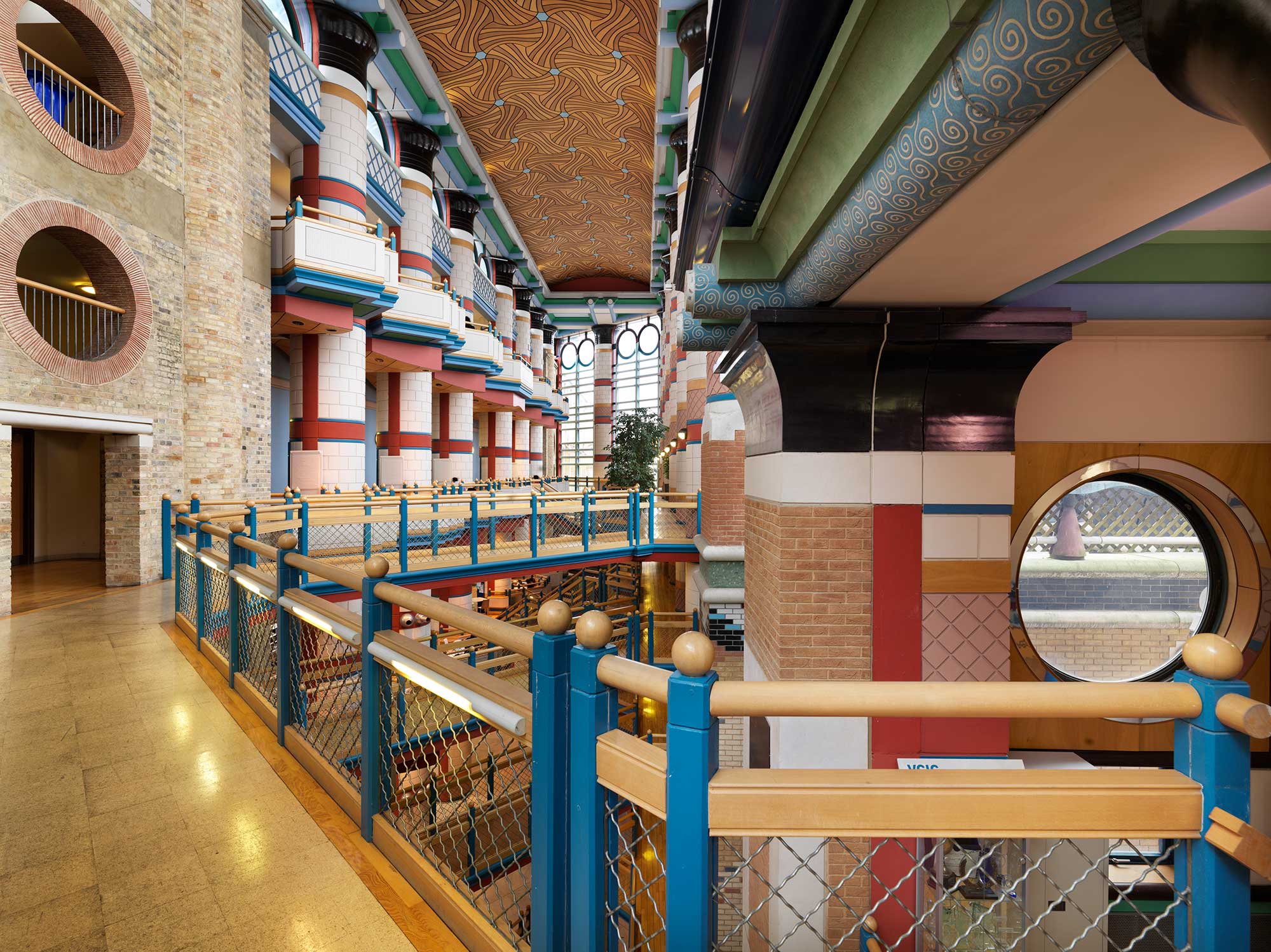 Modern interior with pillars and brickwork painted in bright colours