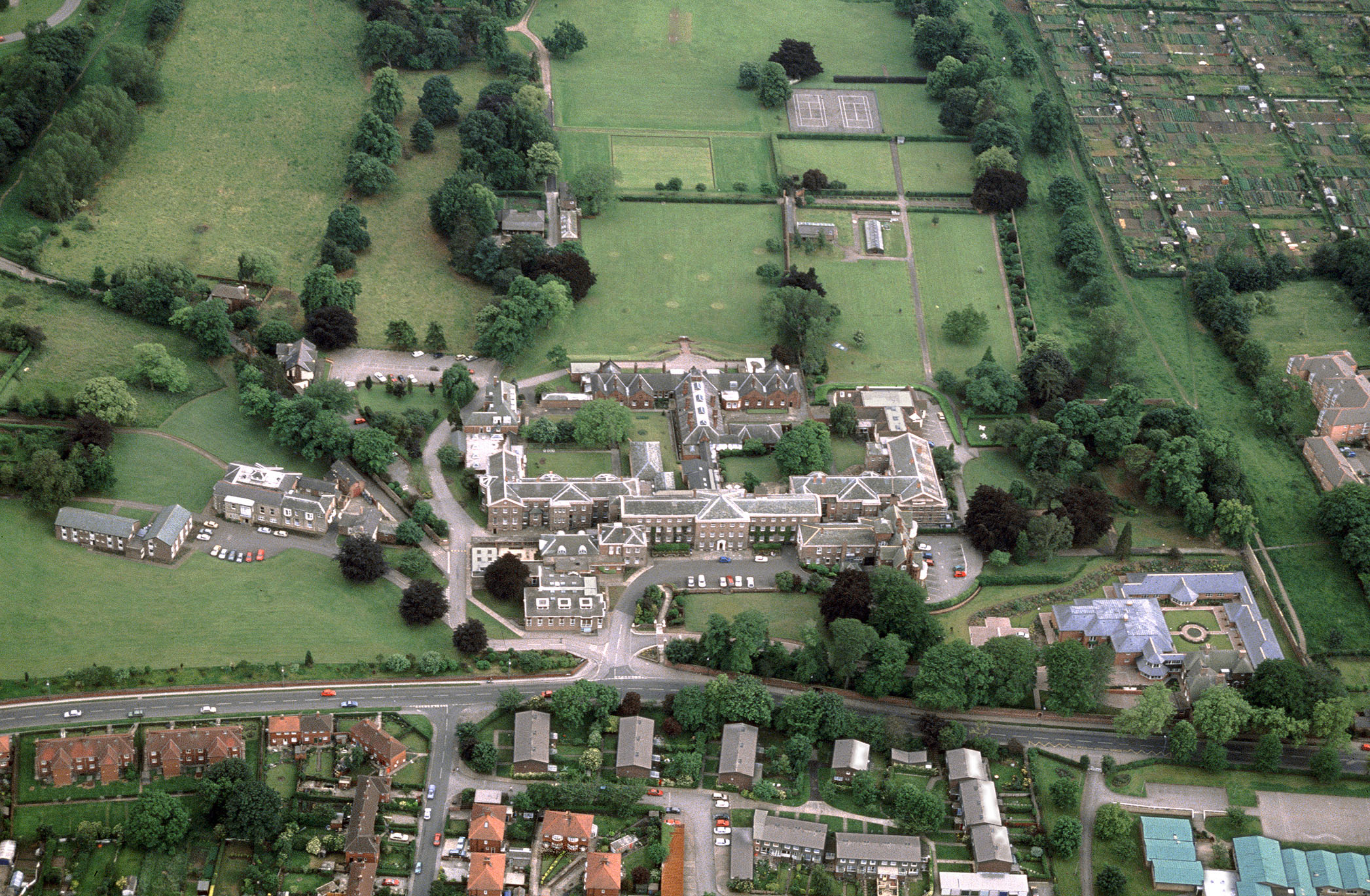 Aerial view of Georgian hospital and grounds in an urban setting. 