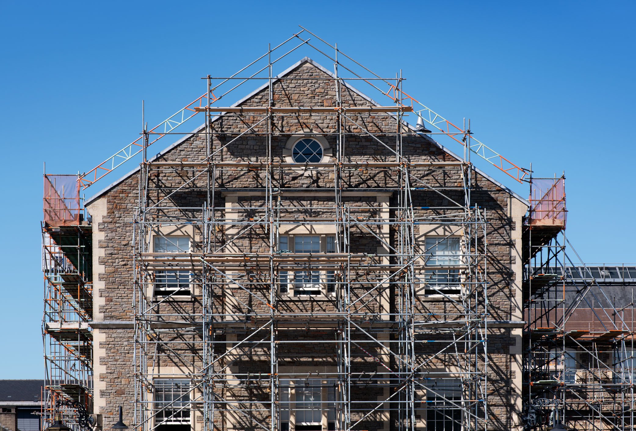 A Victorian office building with scaffolding.