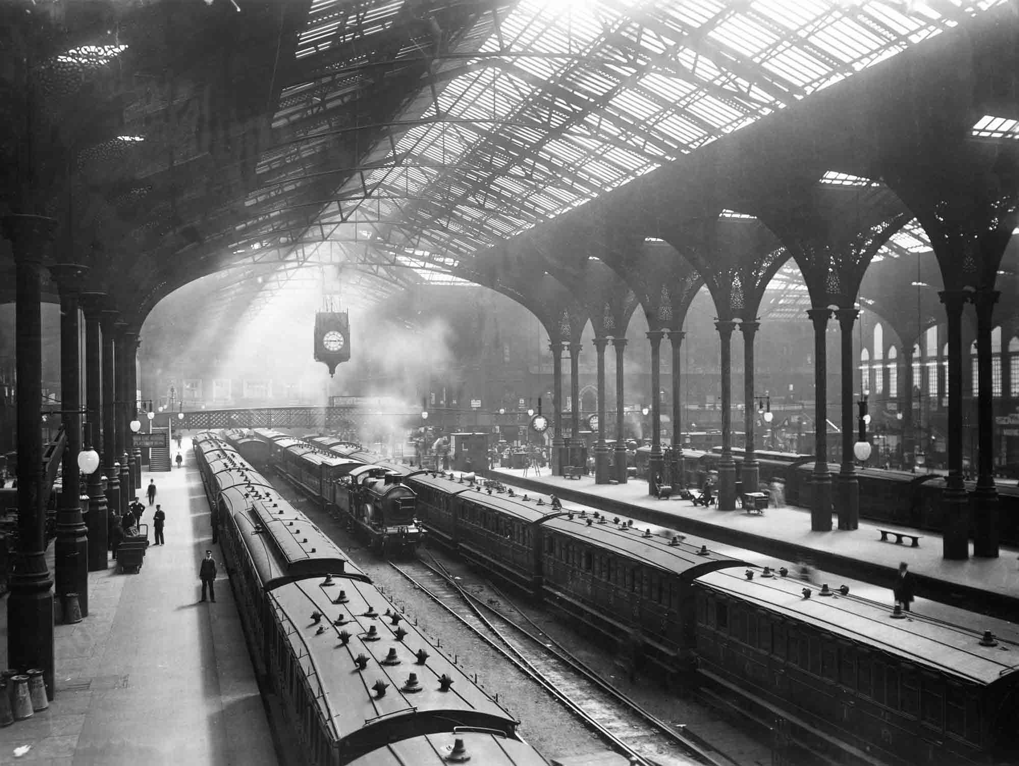 Black and white photo of the train shed at Liverpool Street Station