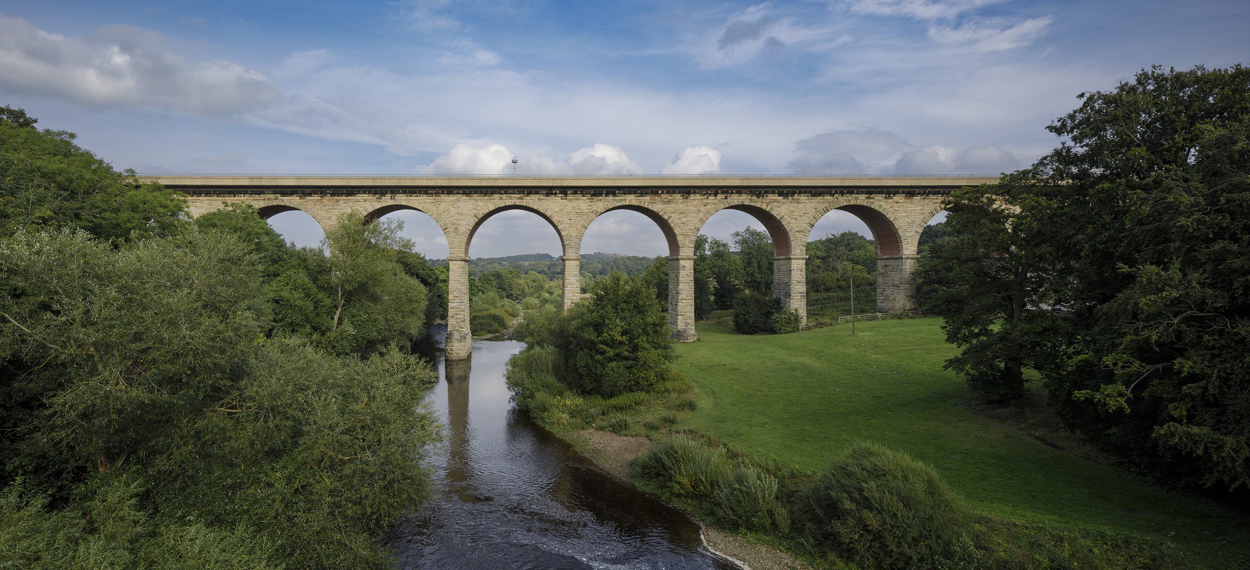 A multi-arched bridge spanning a river