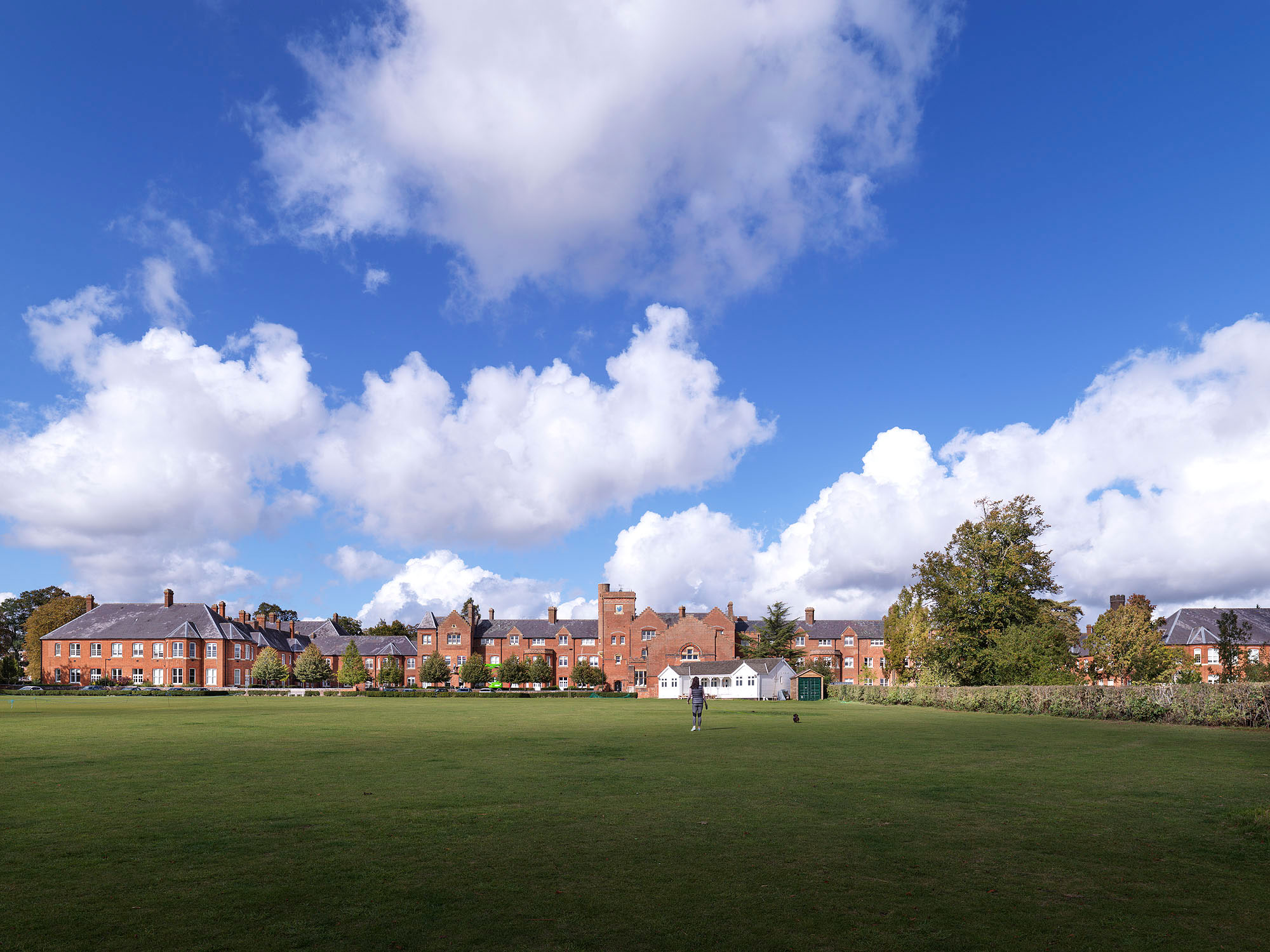 A view over grounds to a redeveloped former Victorian hospital complex.