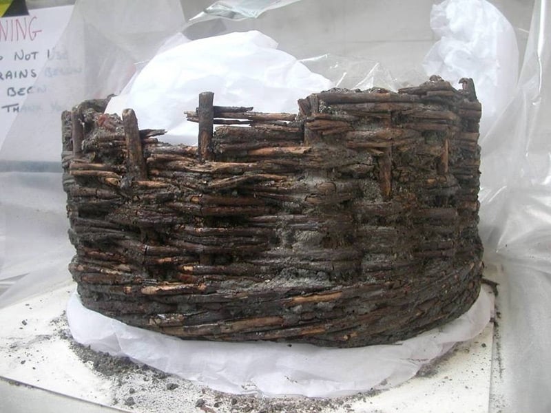 Basket in the process of being cleaned on the exterior (left: clean, right unclean)