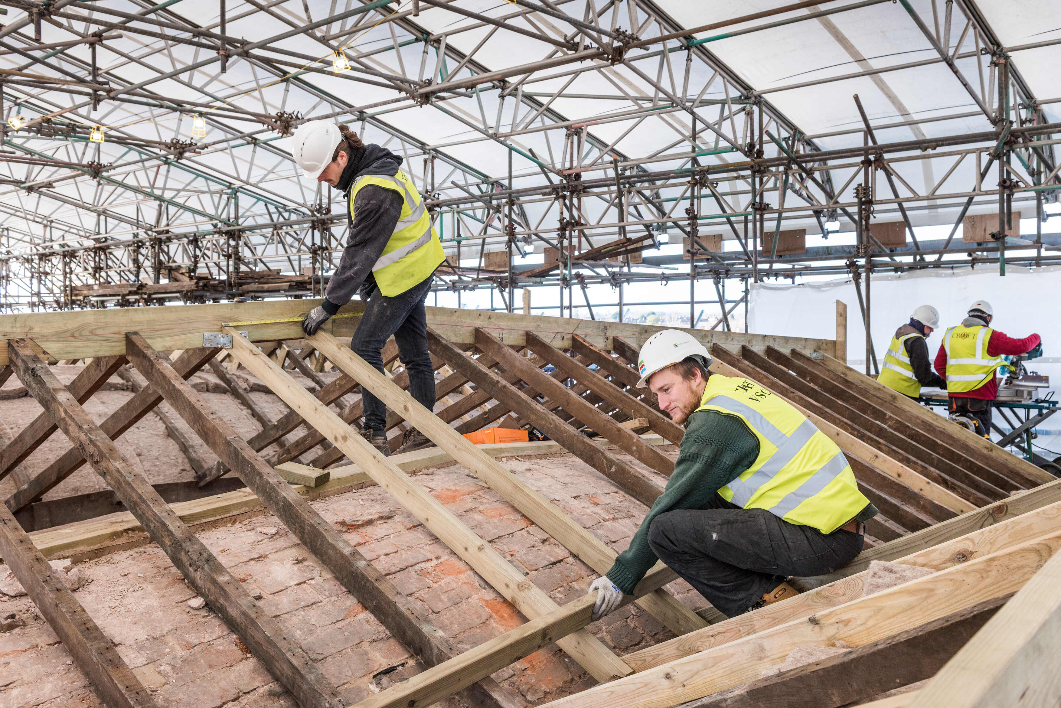 Prince’s Foundation placements Tom Mott and Sam Rowland-Simms working on the roof at Shrewsbury Flaxmill Maltings, Shropshire.