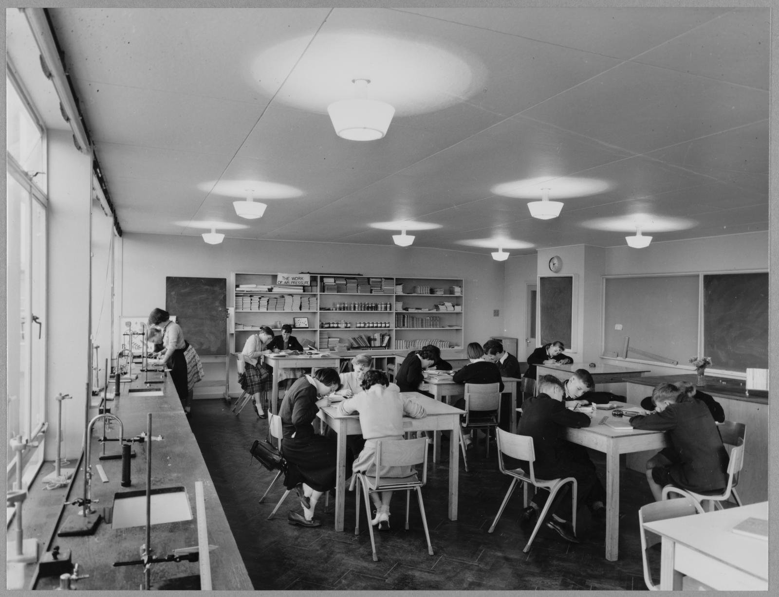 Children at their desks in a science laboratory