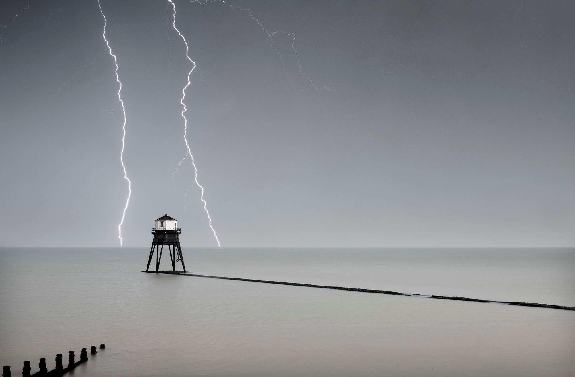 General view of the Dovercourt outer lighthouse with stormy sky and lightening