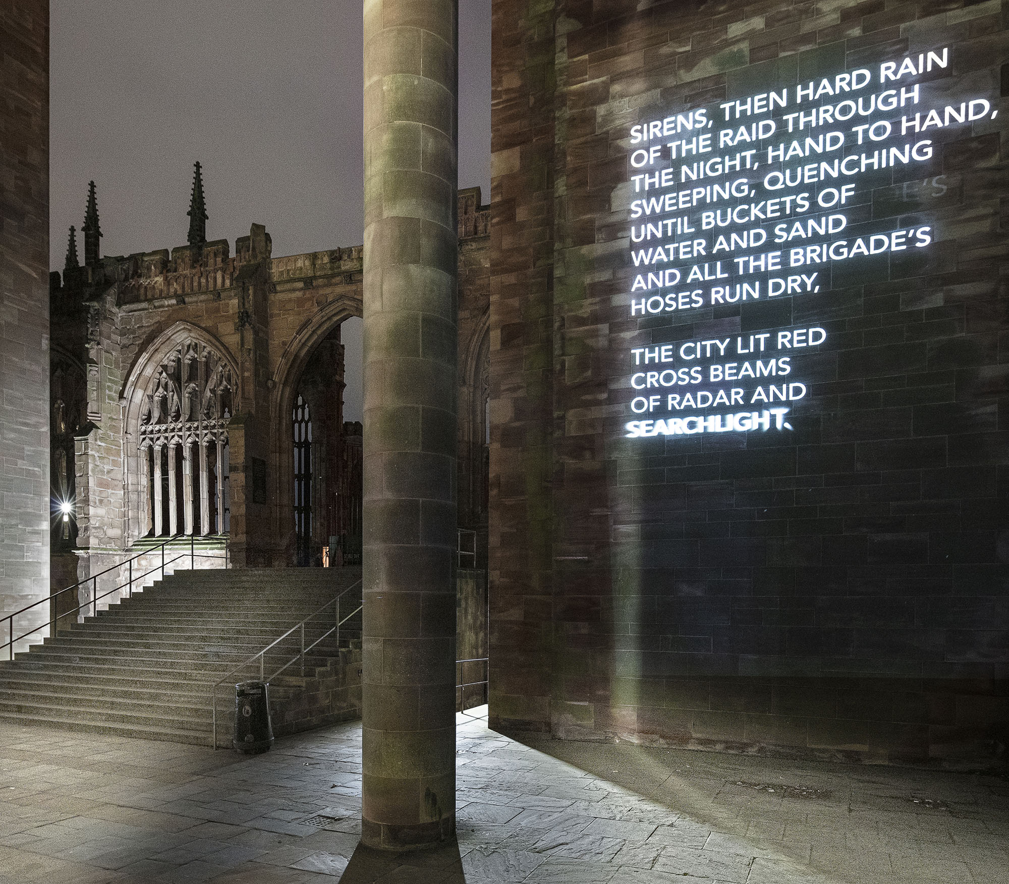 Words from poem projected onto wall of the cathedral