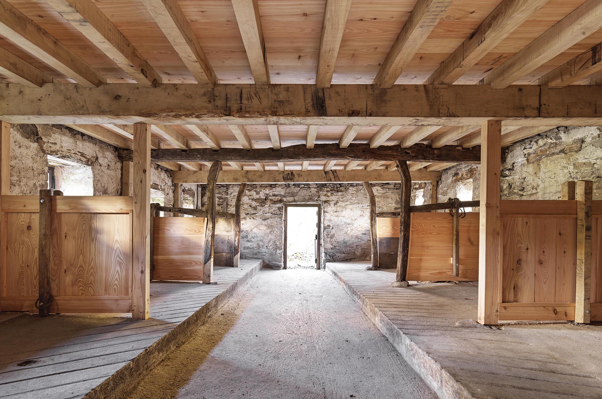 Interior of the newly restored field barn with cattle bays