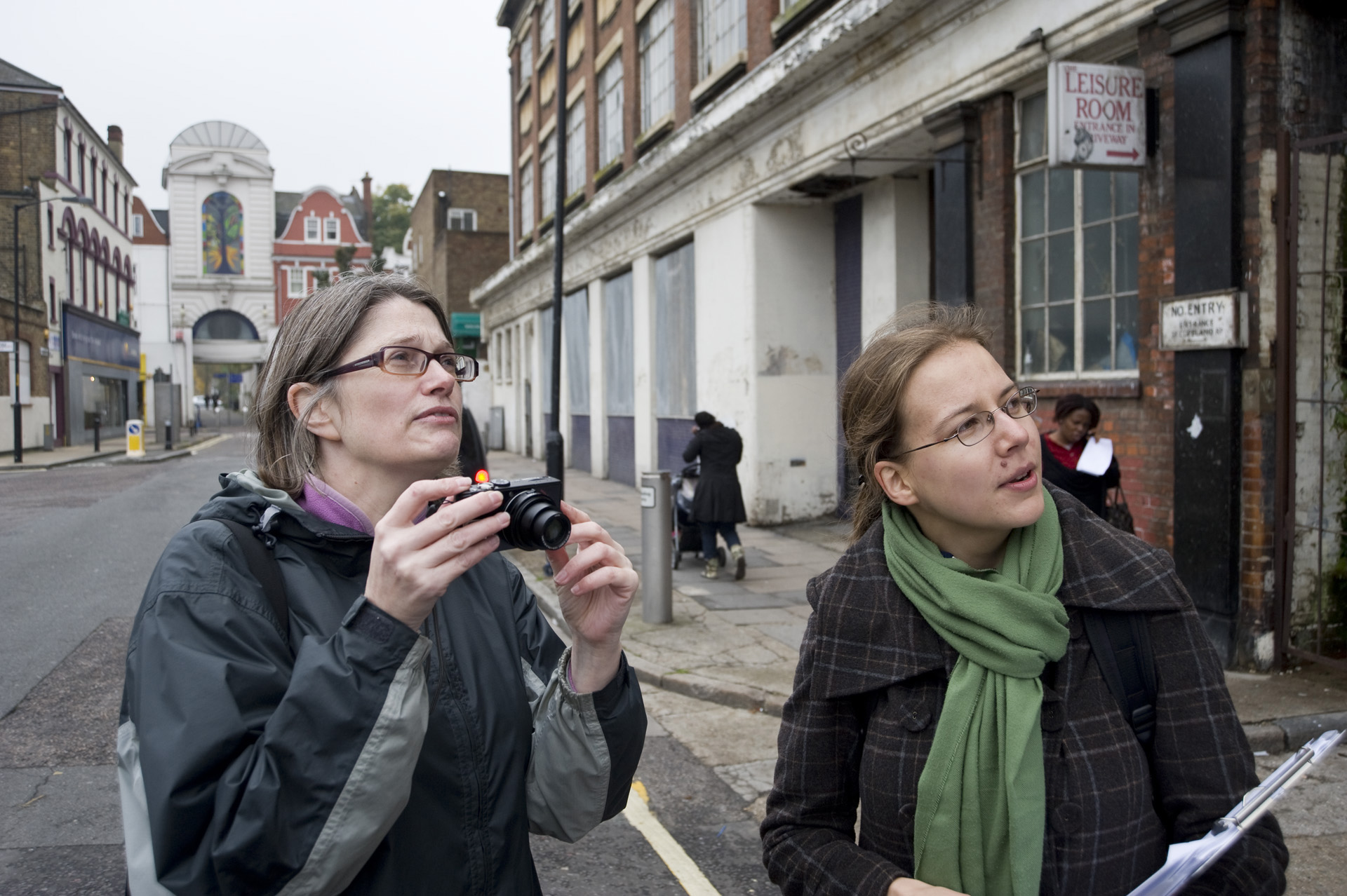 Two women carrying out survey in street