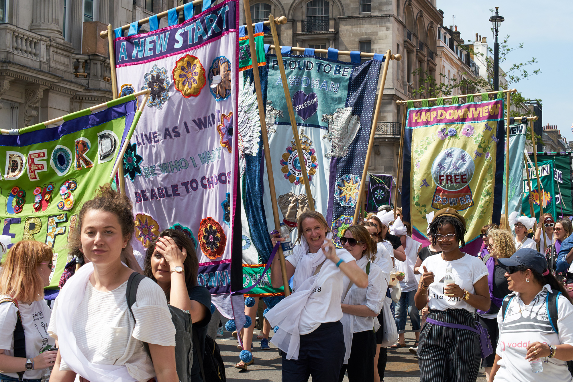 Procession of people carrying banners