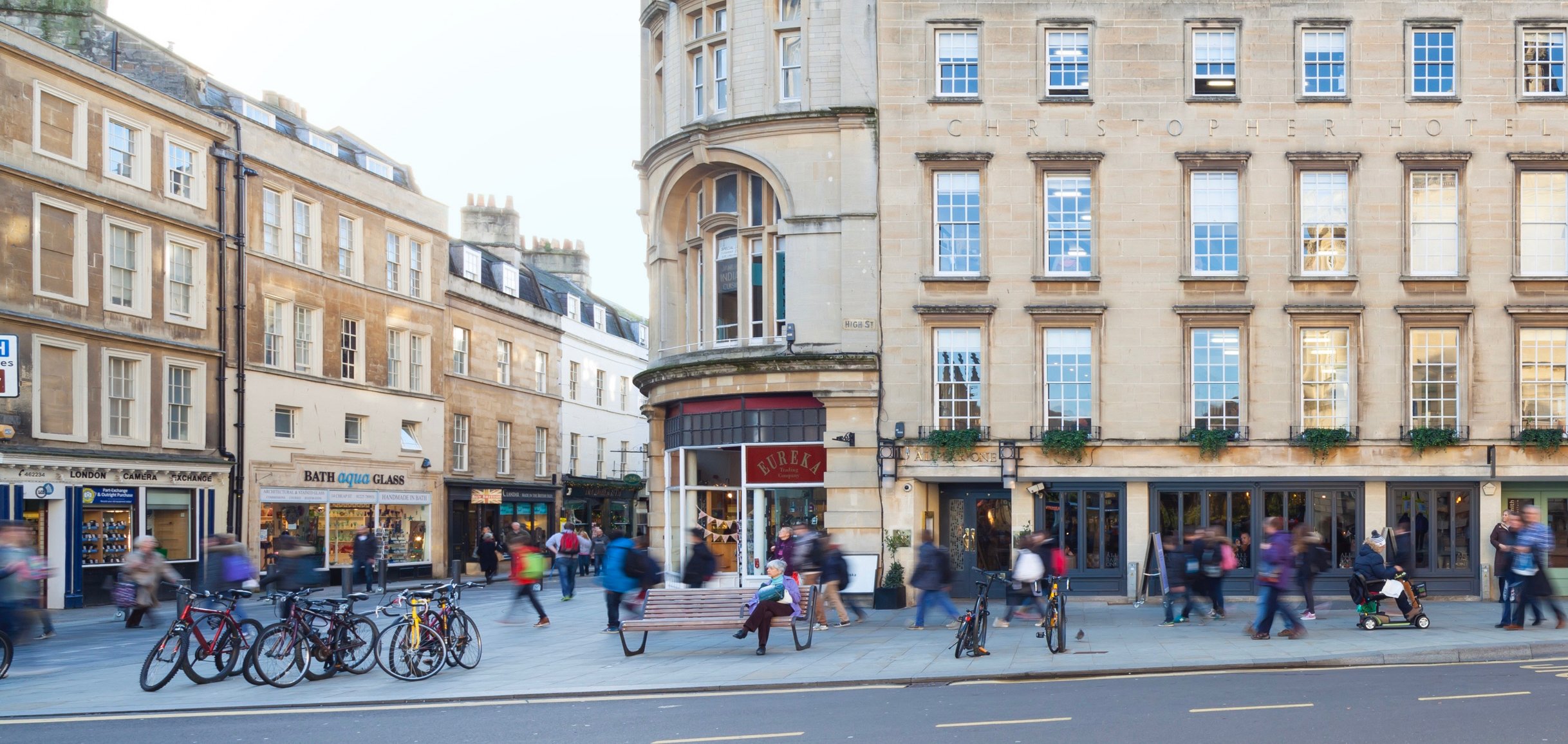 Busy pavement and pedestrianised area in Bath.