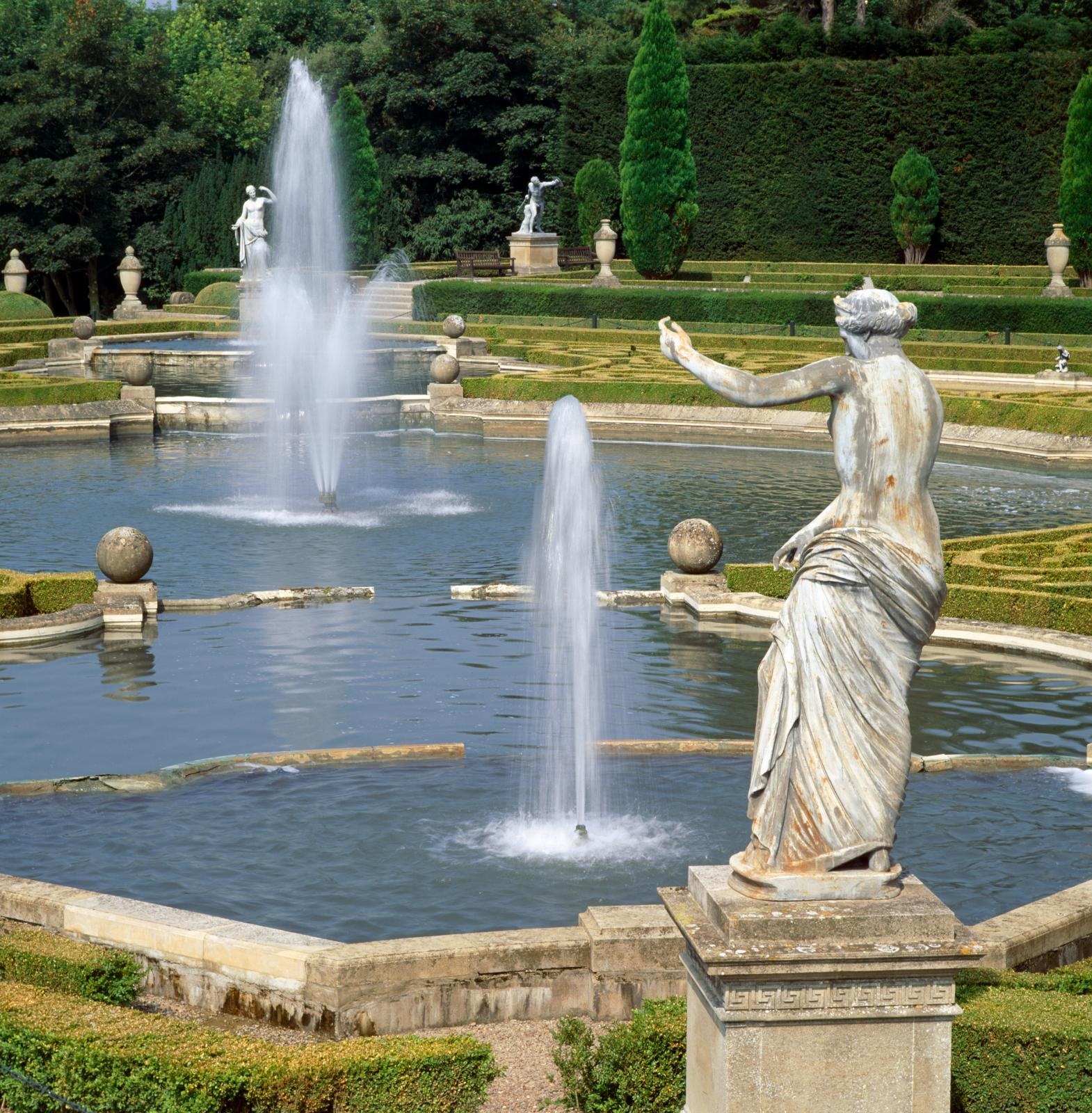 Fountains and ponds with stone statues located around them