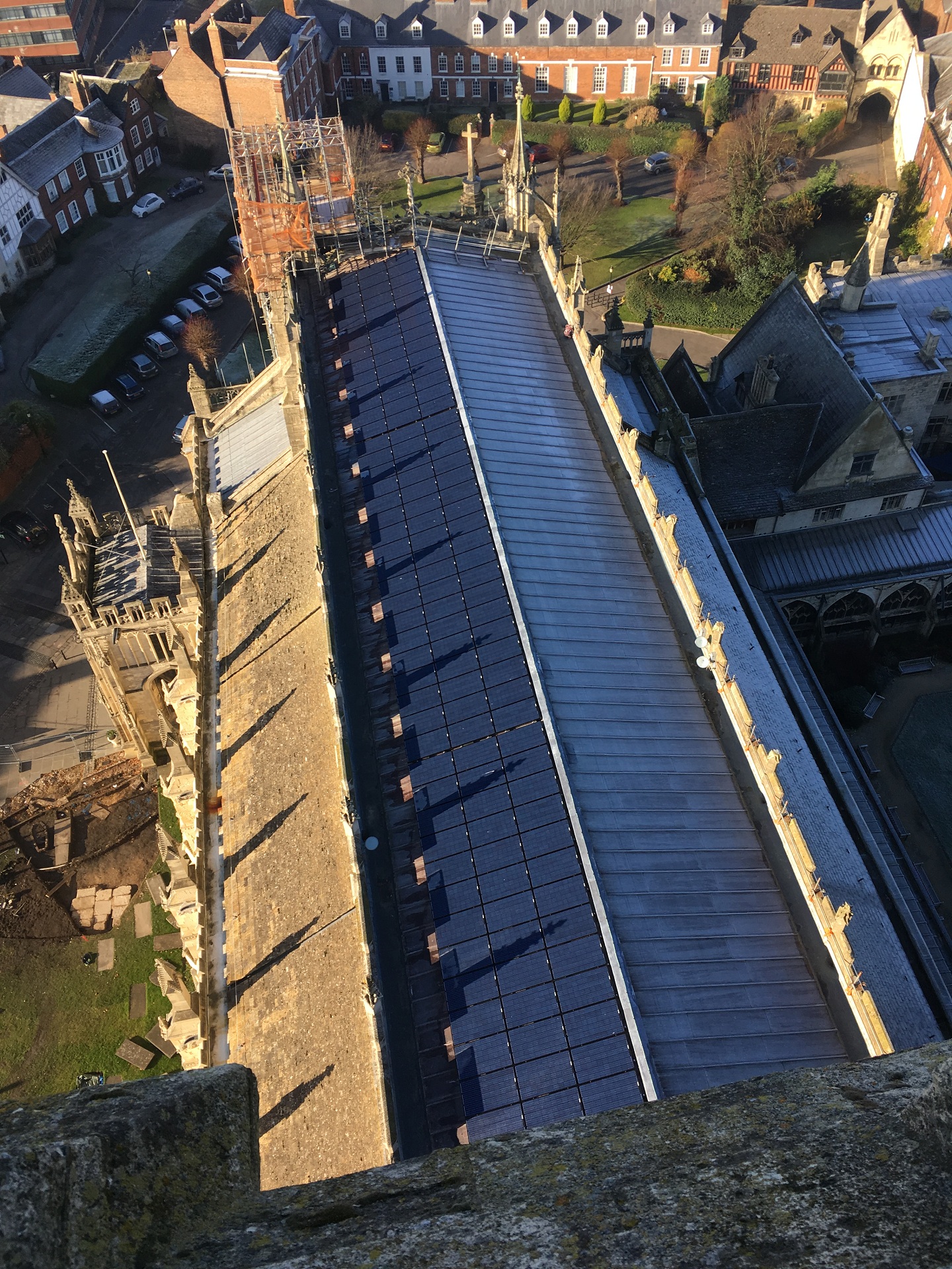 A view along the roof of the nave of Gloucester Cathedral showing the solar panels.
