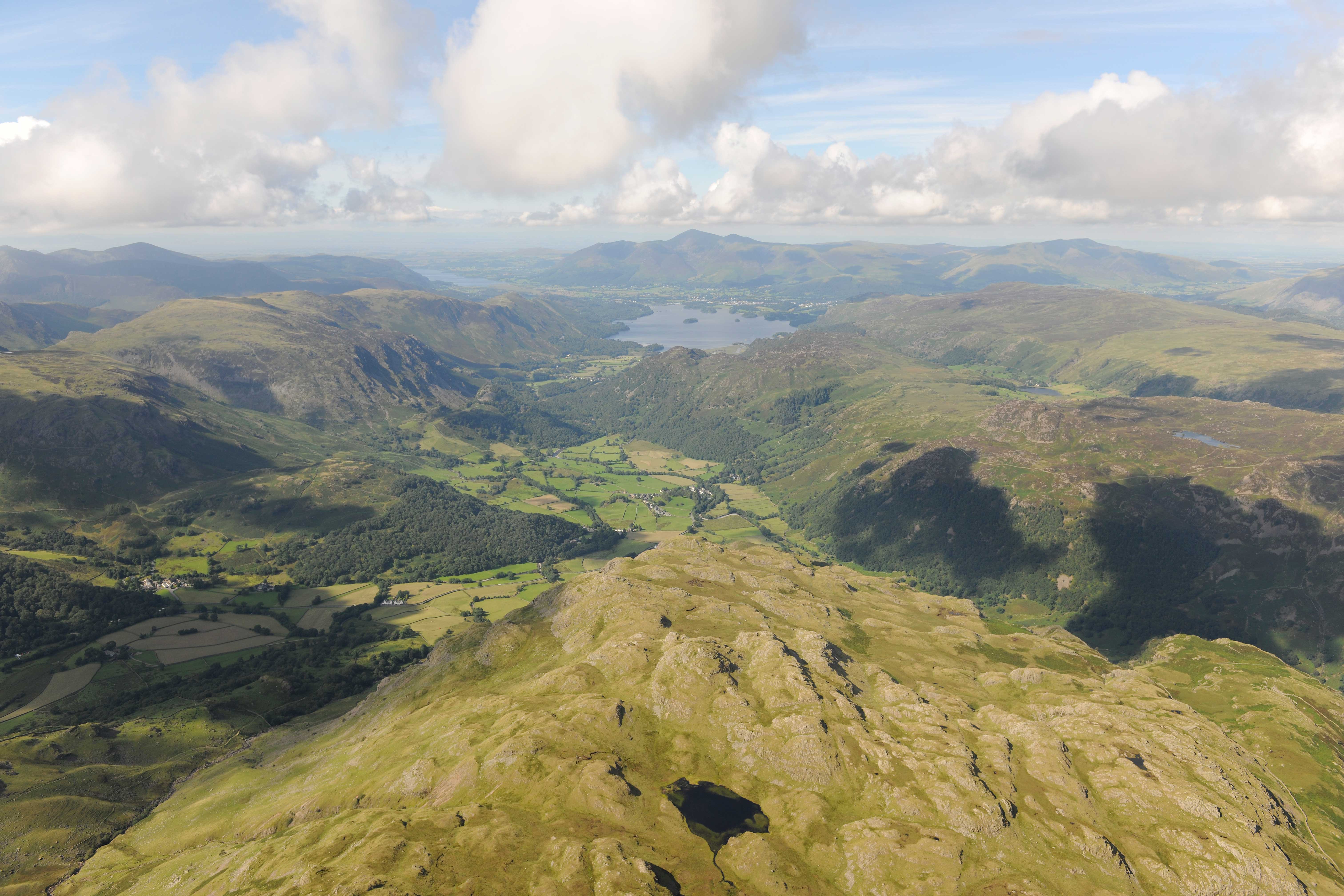 Aerial view of Rosthwaite Fell with Derwent Water and Bassenthwaite Lake in the distance.