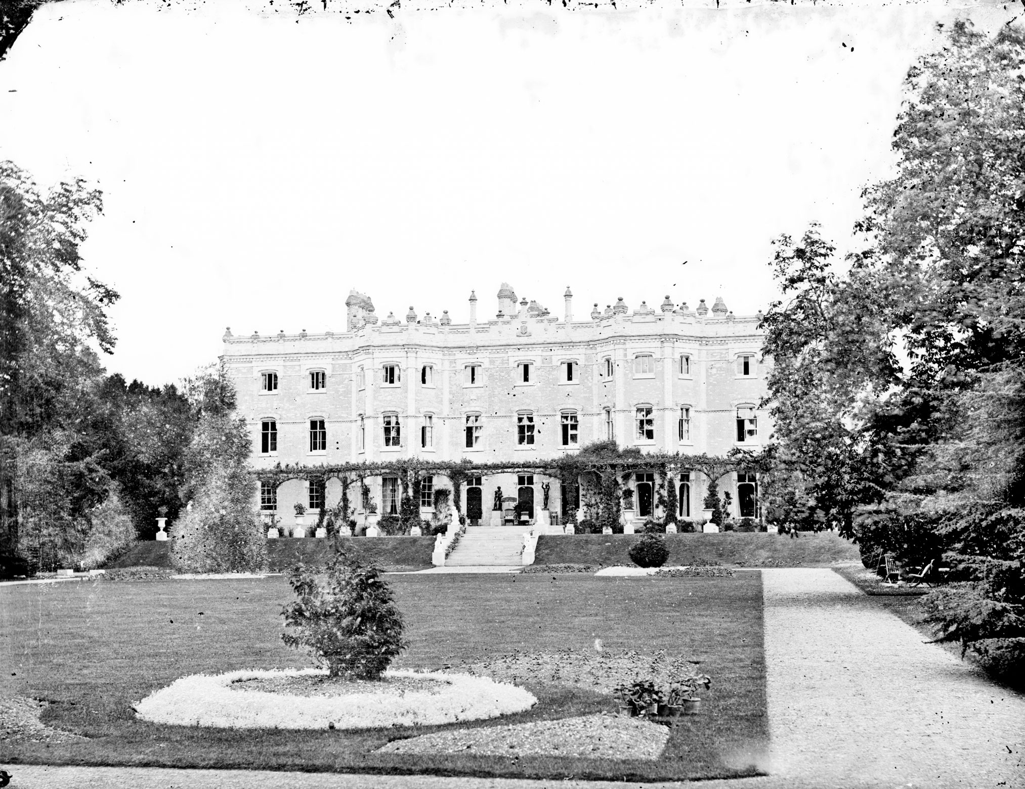 Victorian Archive image showing the garden, facade and terrace of a three-storey Country House.