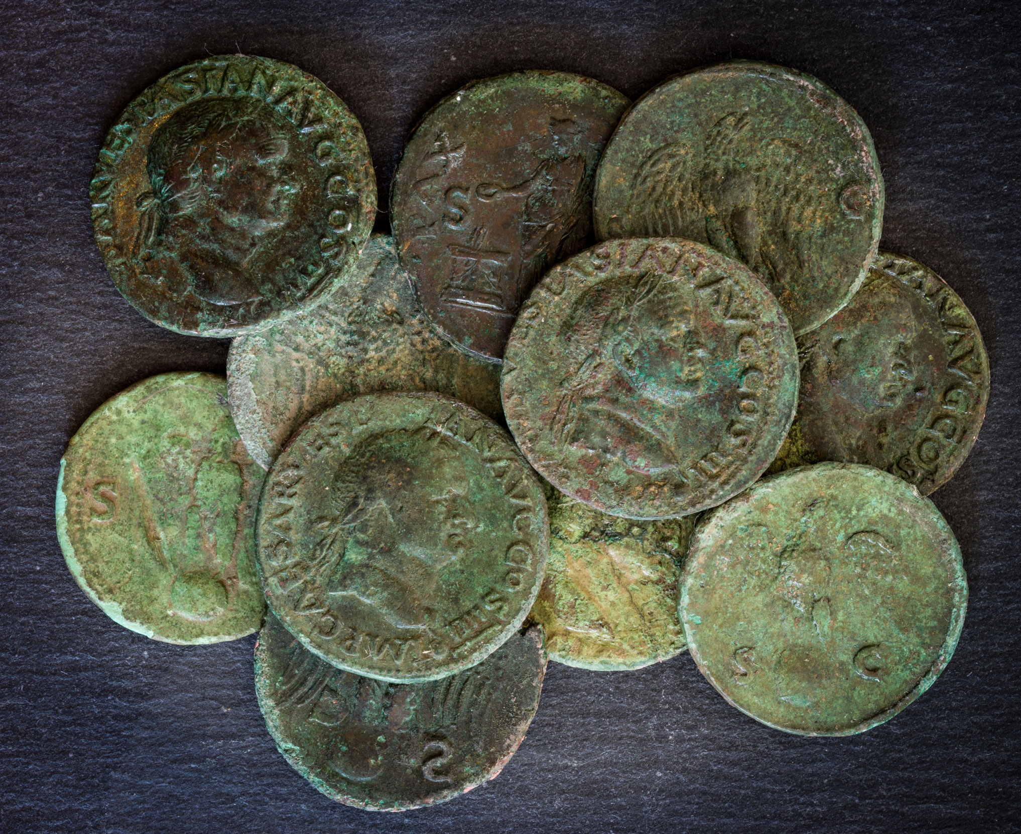 A selection of coins including those bearing the name of the Roman emperor Vespasian.