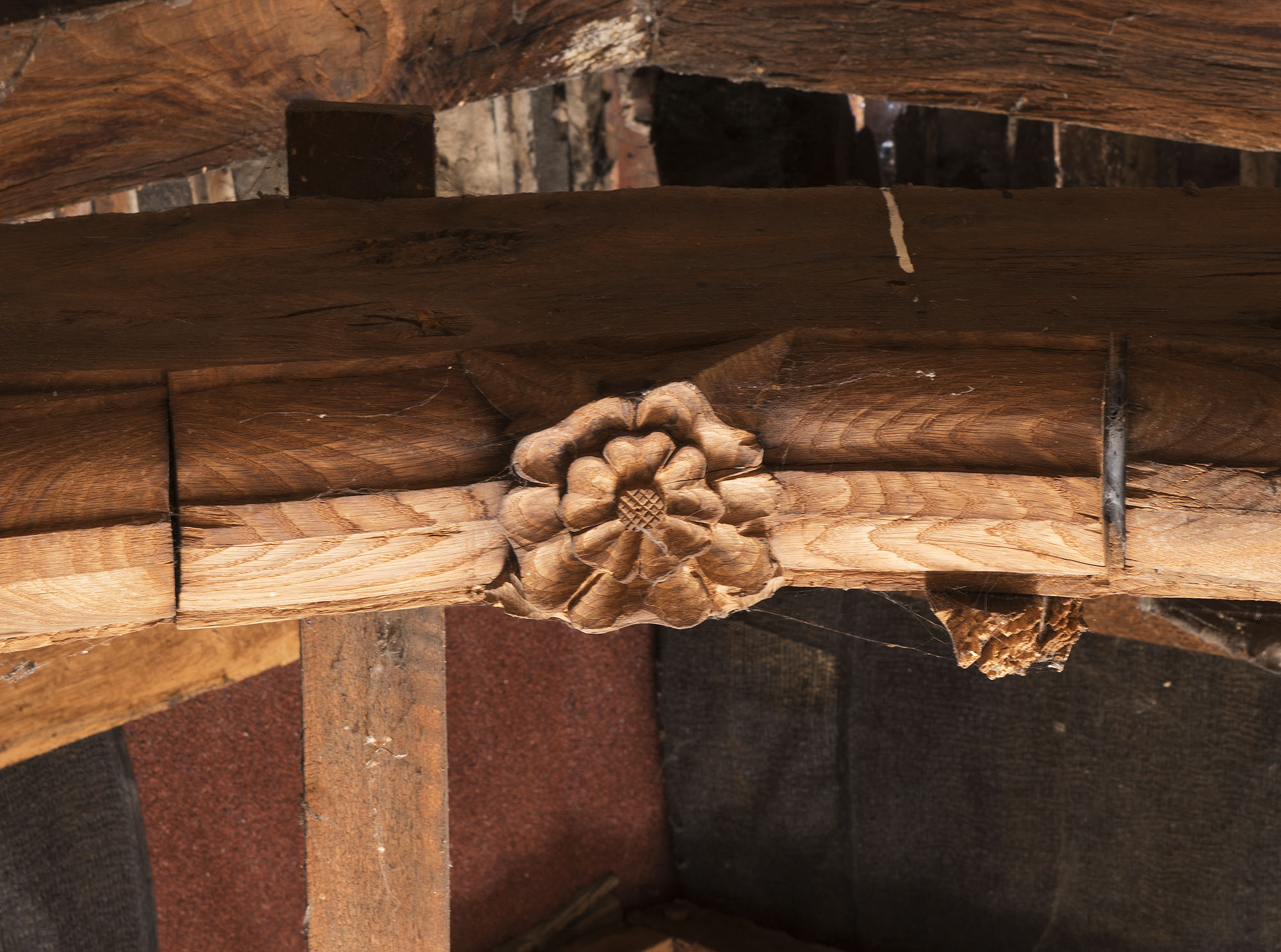 Interior close up of a decorated roof timber at the Grade II* listed 31 High Street, Droitwich Spa.