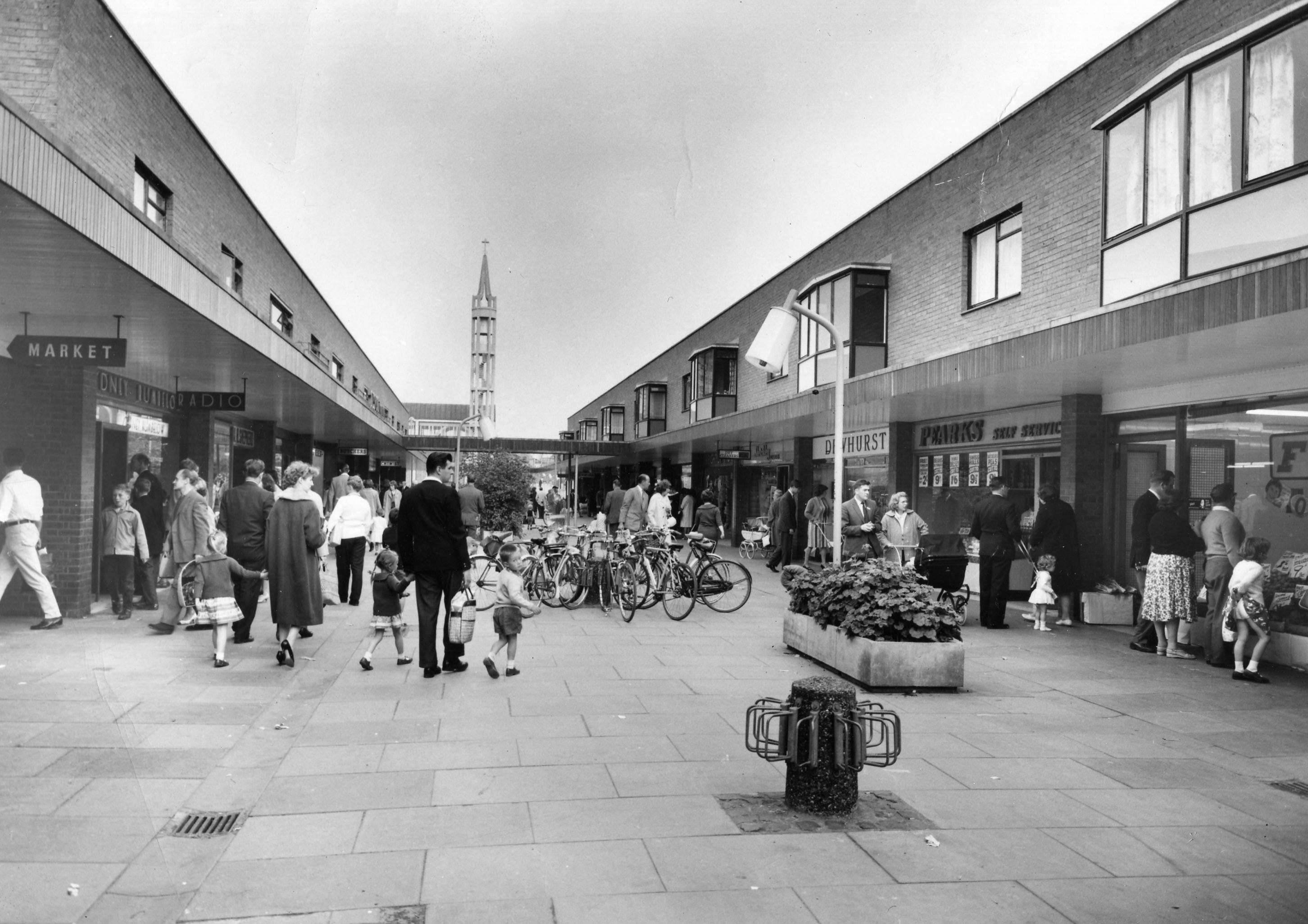 Old photo of people in a pedestrianised shopping street